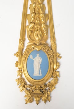 Pair of gilded bronze wall sconces with Wedgwood plaques, Louis XVI style.