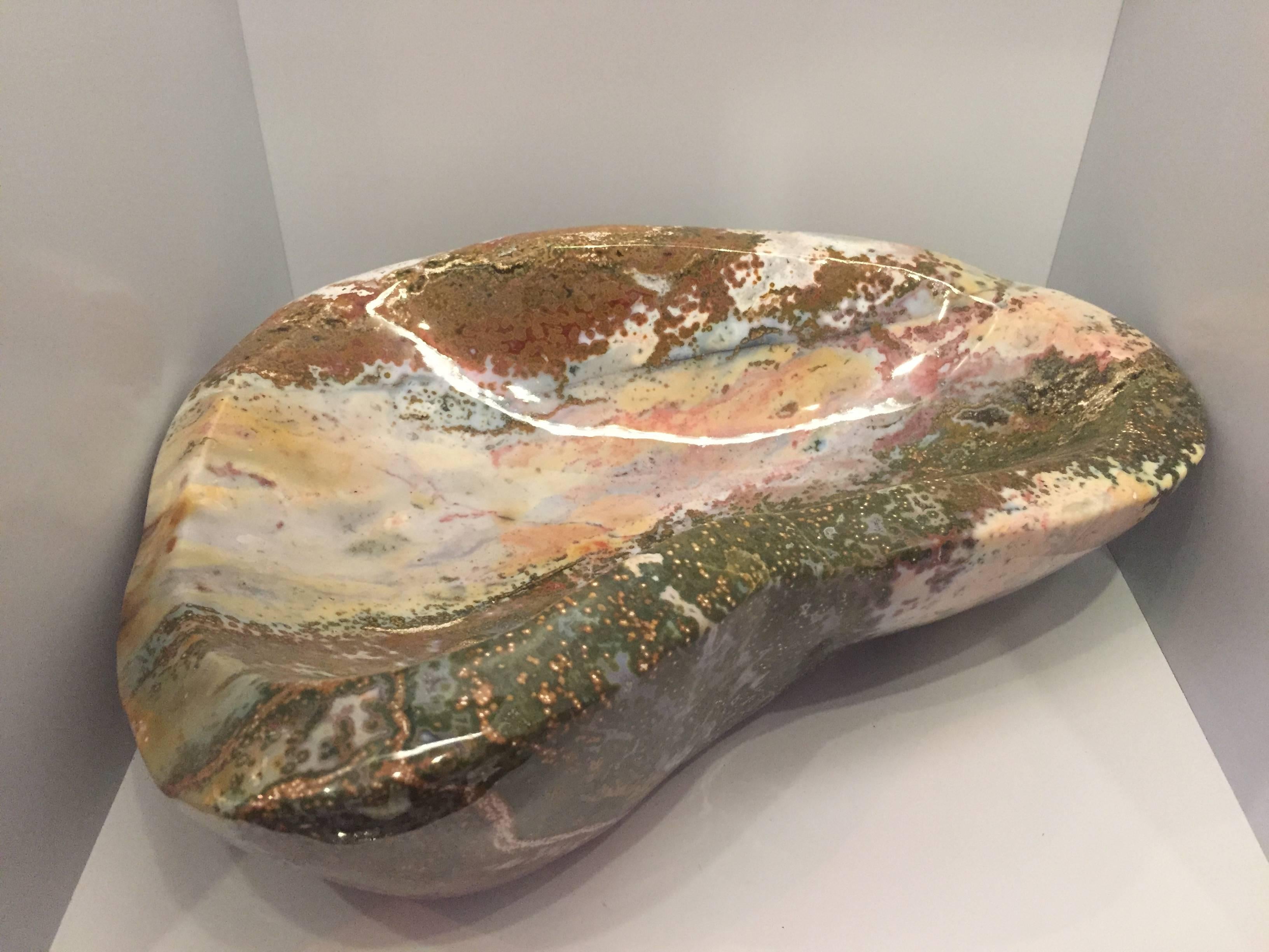 Beautiful, hand-carved giant ocean jasper vide-poche from Madagascar, selected for it's broad spectrum of colors and unusually large size. A very impressive desk or table item it can also be used as receptacle for keys etc, which is where the name