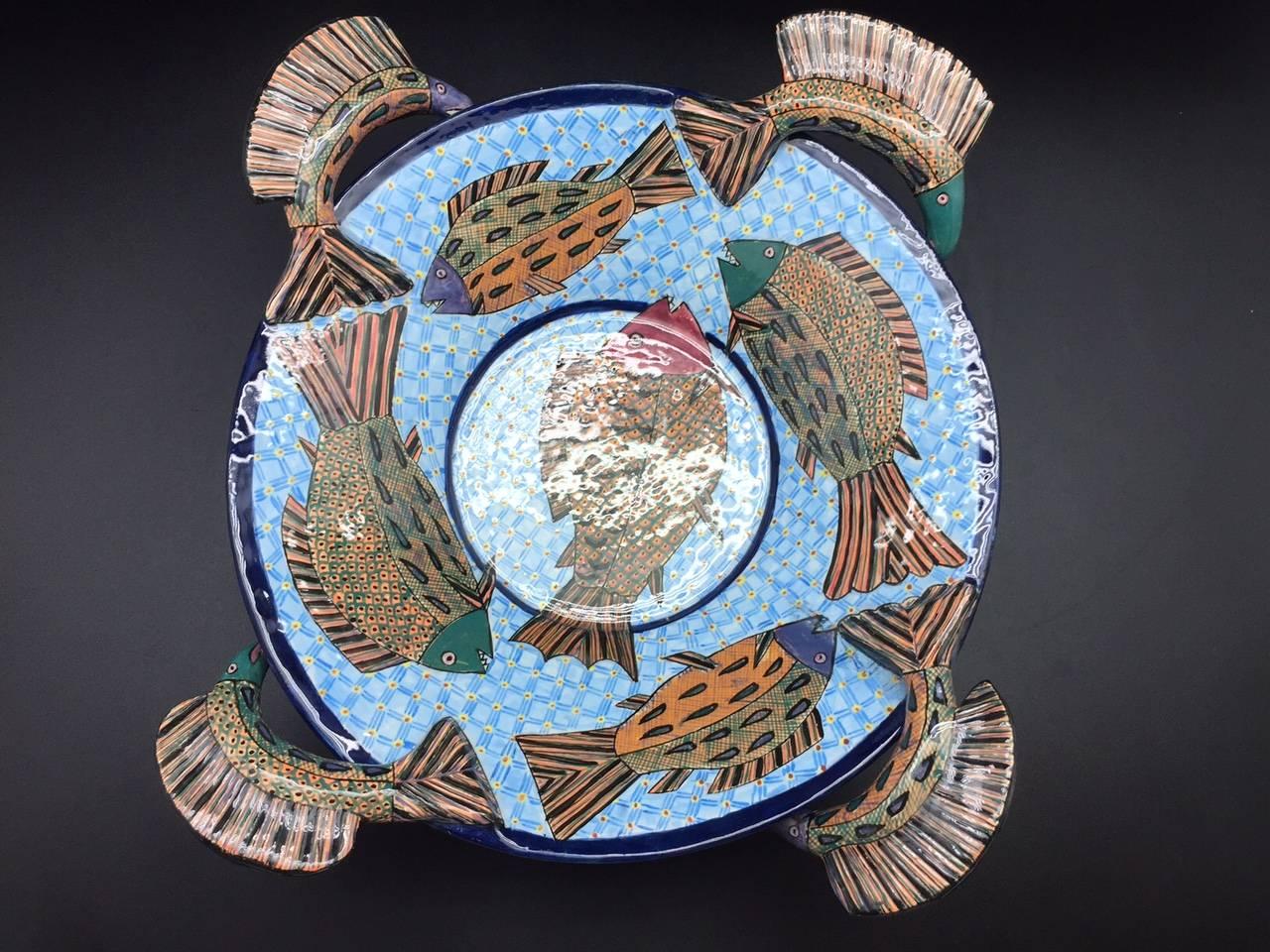 Fish serving bowl, ceramic sculpture by Ardmore from South Africa. Sculpted and painted by Zeblon Msele 17" diameter x 6" H.

Ardmore ceramic art was established by Fée Halsted and is situated in the foothills of the Drakensberg