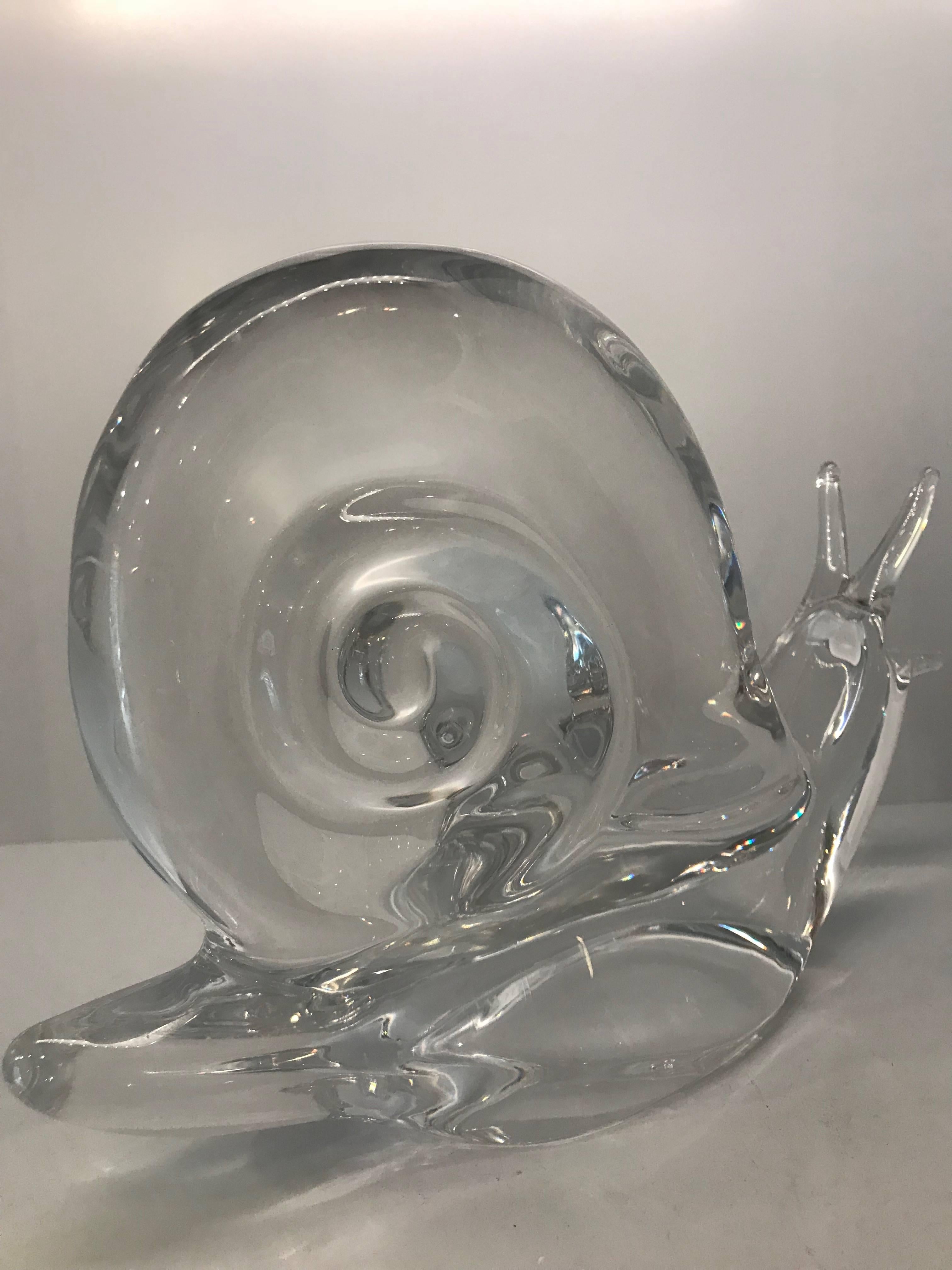 Beautiful crystal snail or escargot from Daum. Daum is a crystal studio based in Nancy, France, founded in 1878 by Jean Daum.