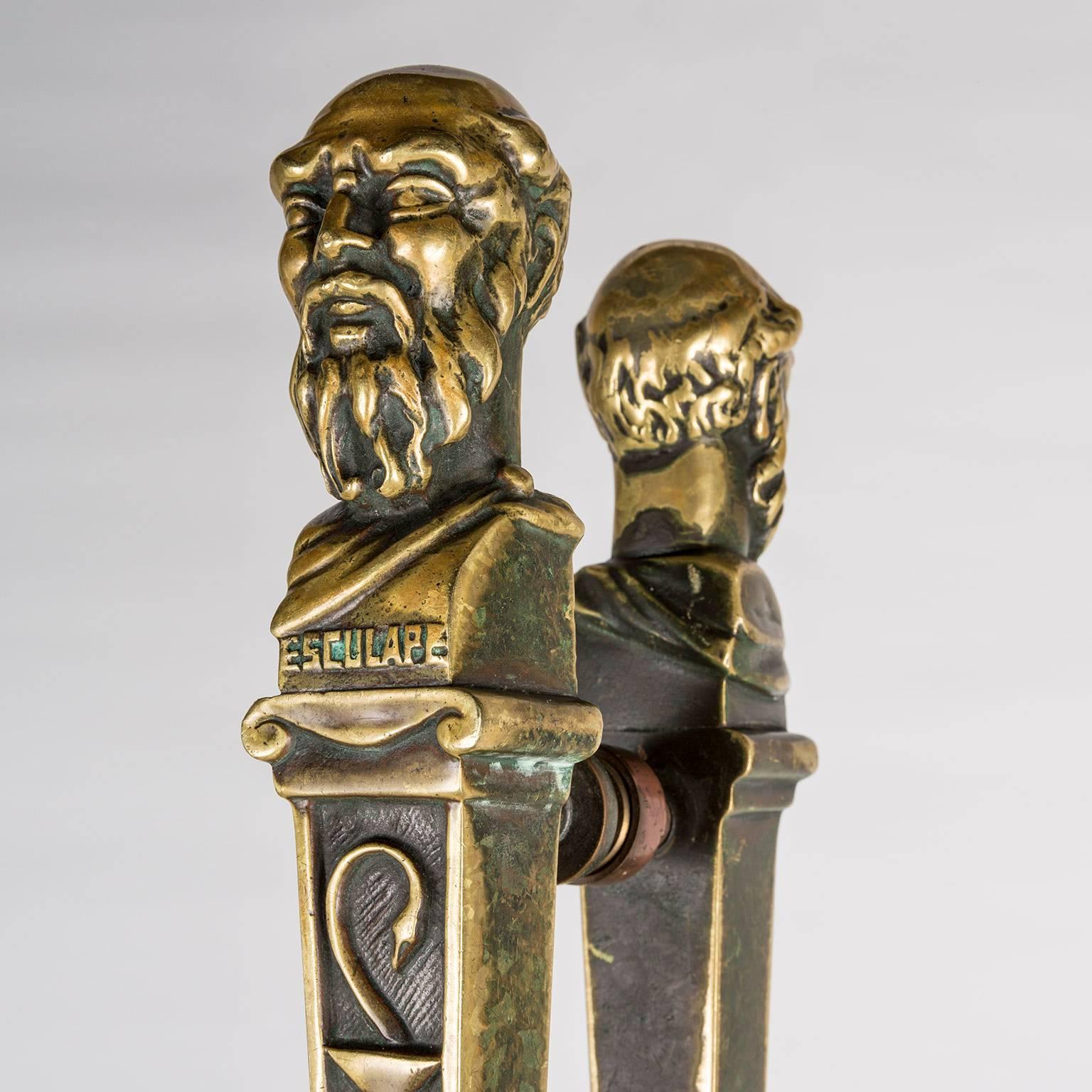 French 19th century brass pharmacy door handles inscribed Esculape (Aesclepius, the Greco-Roman god of healing) and with the insignia of a caduceus symbolizing a physician. The two pairs came from a Medical Pharmacy in Paris that was established in