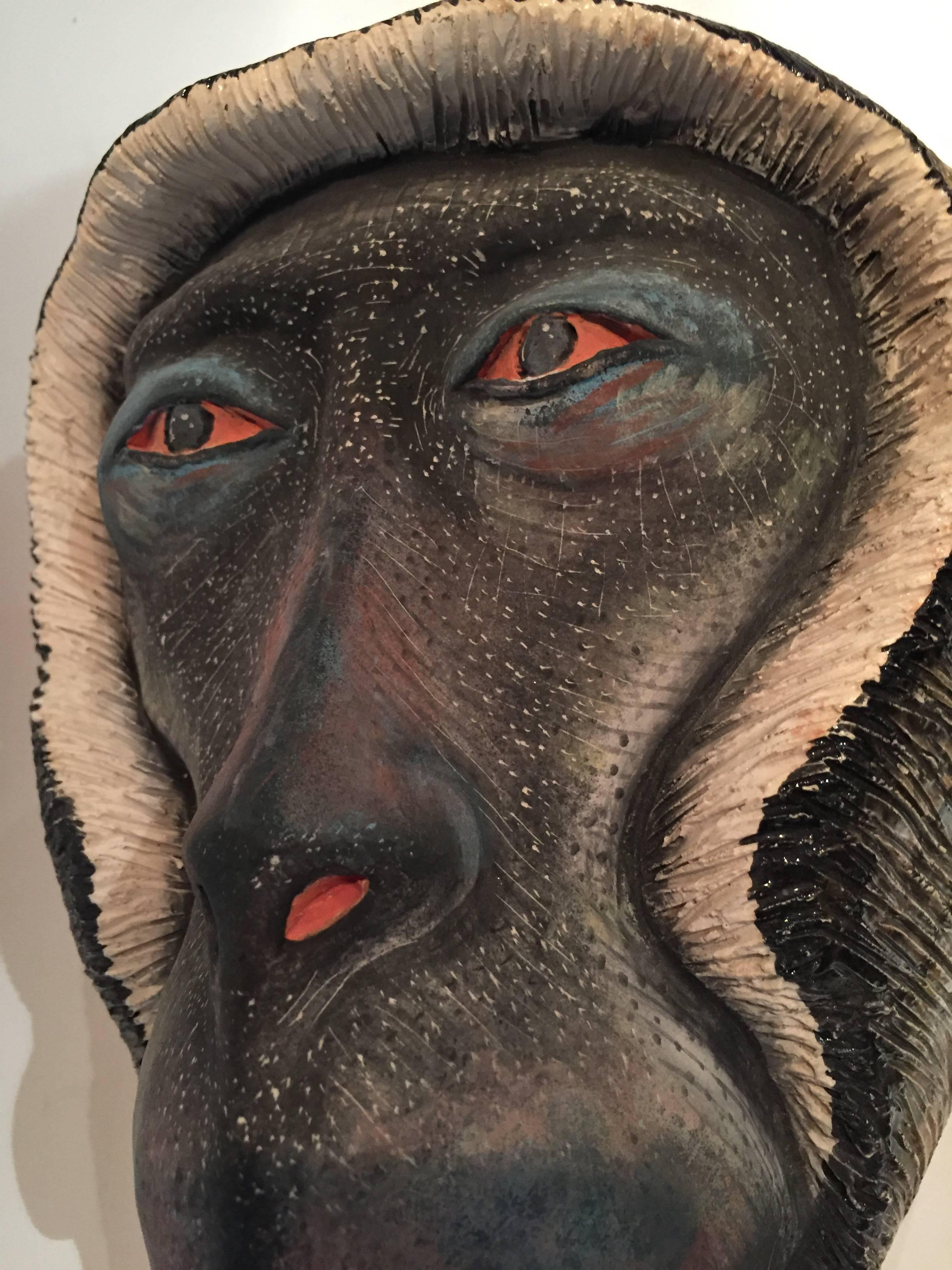 Monkey Mask, ceramic sculpture by Ardmore from South Africa. Sculpted and painted by Engelbert Nyoni. 

Ardmore ceramic art was established by Fée Halsted and is situated in the foothills of the Drakensberg Mountains of KwaZulu-Natal where artists