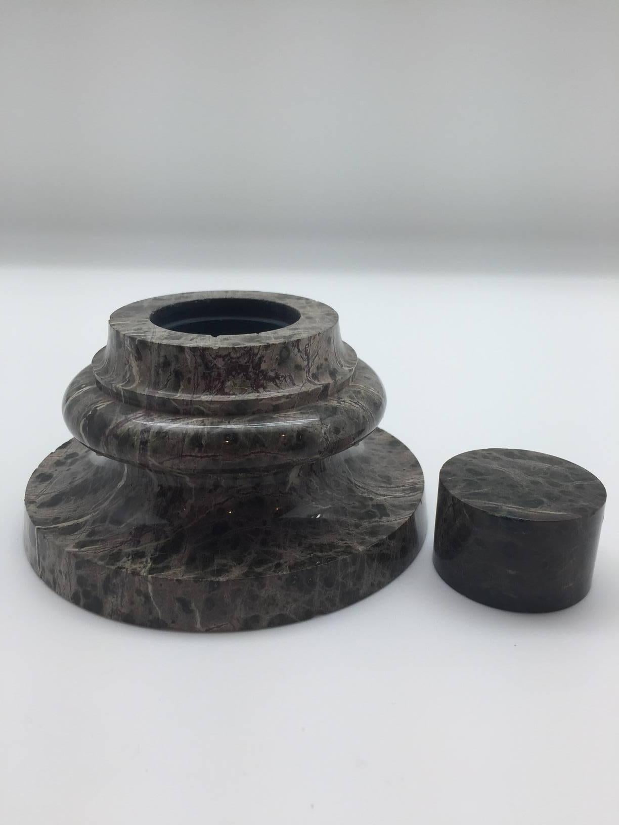 English 19th century cornish serpentine stone inkwell in the form of a neoclassical or Grand Tour turned column base with original fitted lid. Cornish serpentine is from the Lizard Peninsula in Cornwall, England. This mottled stone, which can also