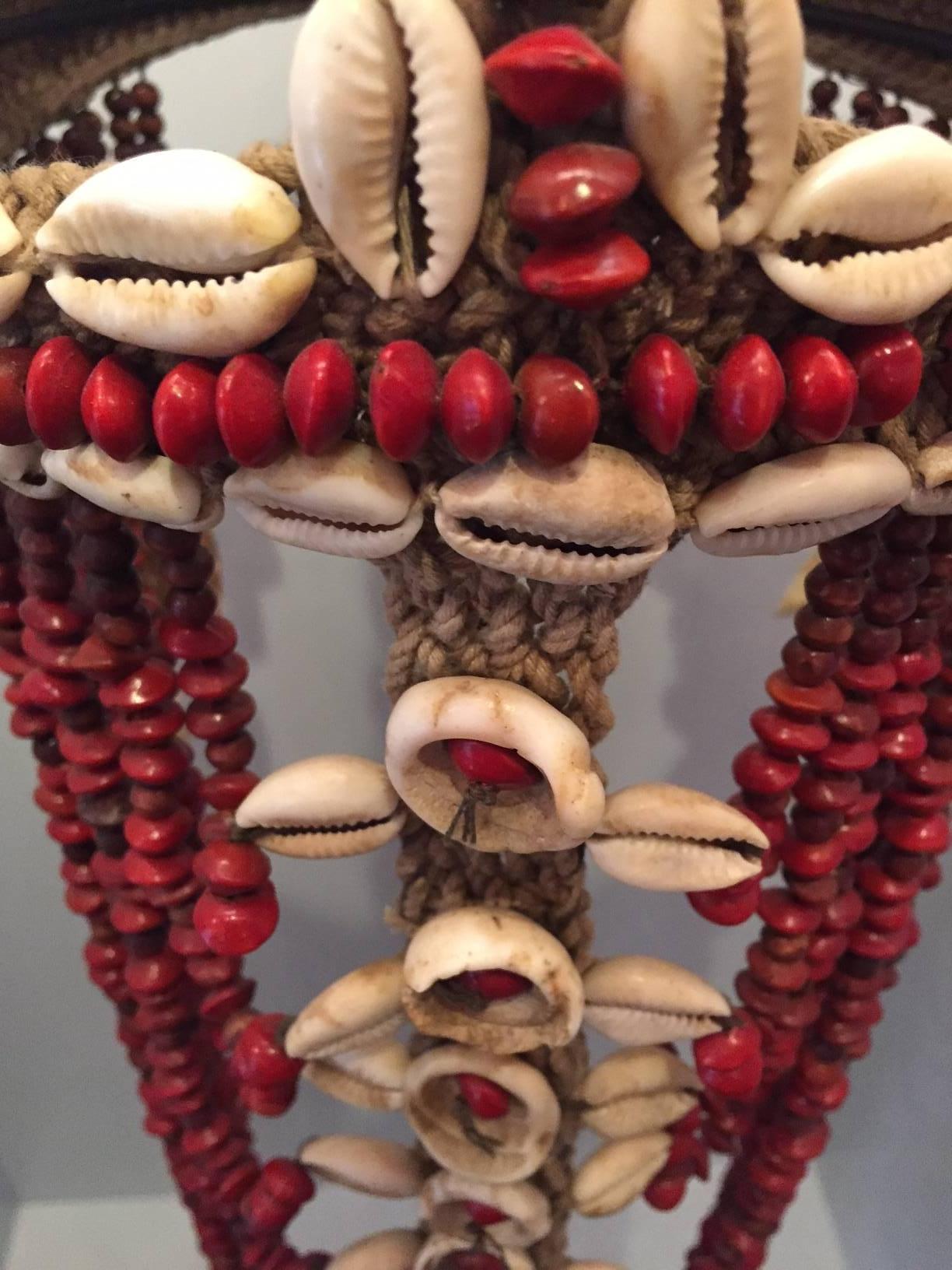 Papua New Guinean Headdress from Papua New Guinea Made from Cowrie Shells and Red Seeds, Mounted 
