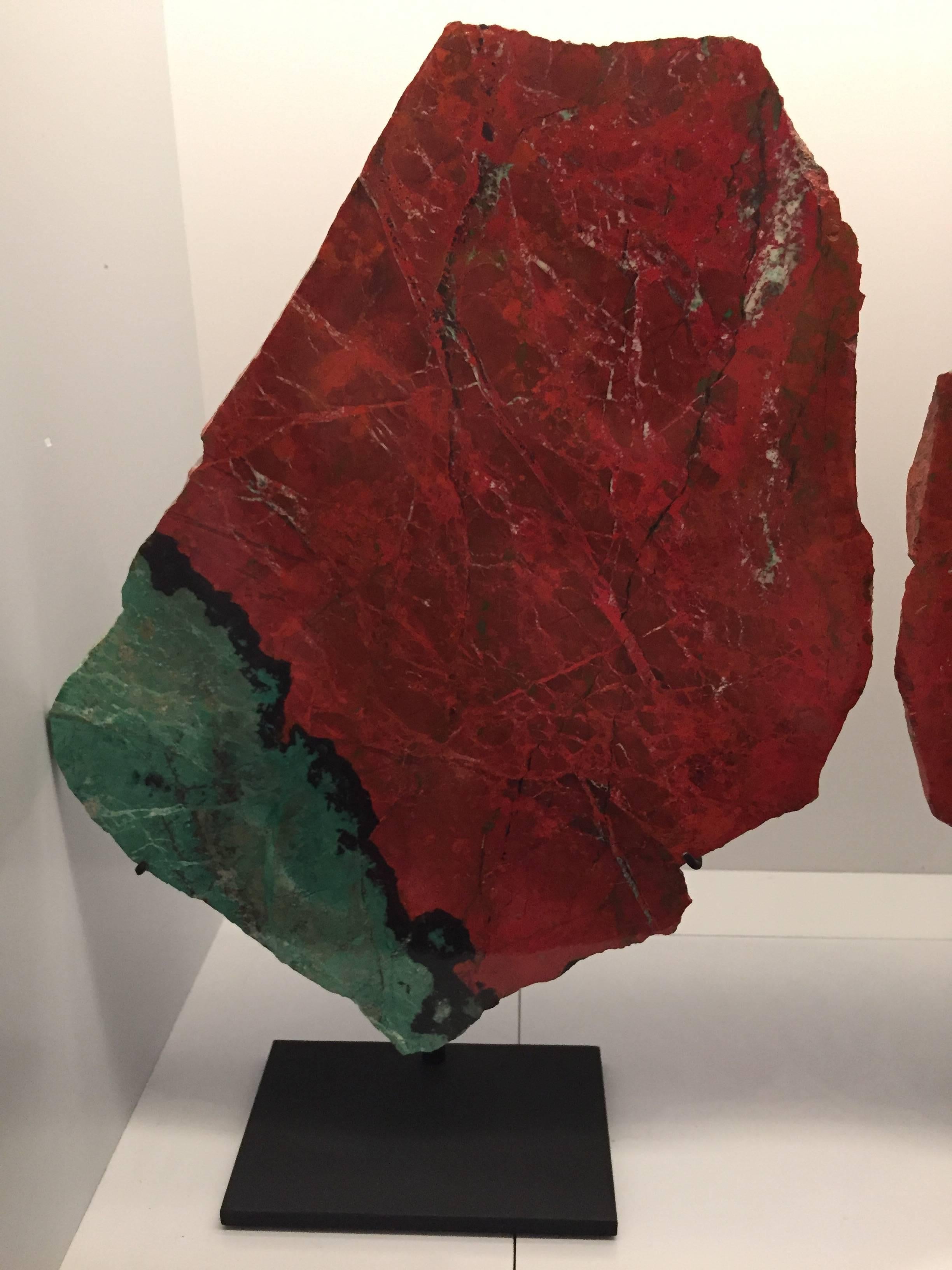 Large bookmatched pair of mounted green and red cuprite chrysocolla specimens AKA Sonora sunset or Sonora sunrise. It is named for the colorful sunsets over the Sonoran Desert, where these specimens were mined.

Measures: 8.5