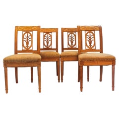 Set of Four French Directoire Period Carved Wood Side Chairs, Circa 1795