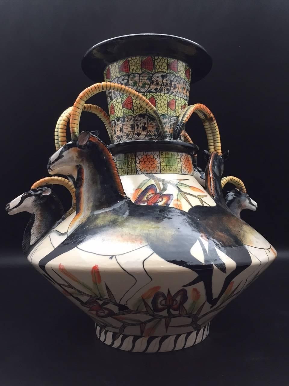 Sable vase, ceramic sculpture by Ardmore from South Africa. Sculpted by Sabelo Khoza and Sondelani Ntshalintshali, painted by Roux Gwala.

Ardmore ceramic art was established by Fée Halsted and is situated in the foothills of the Drakensberg