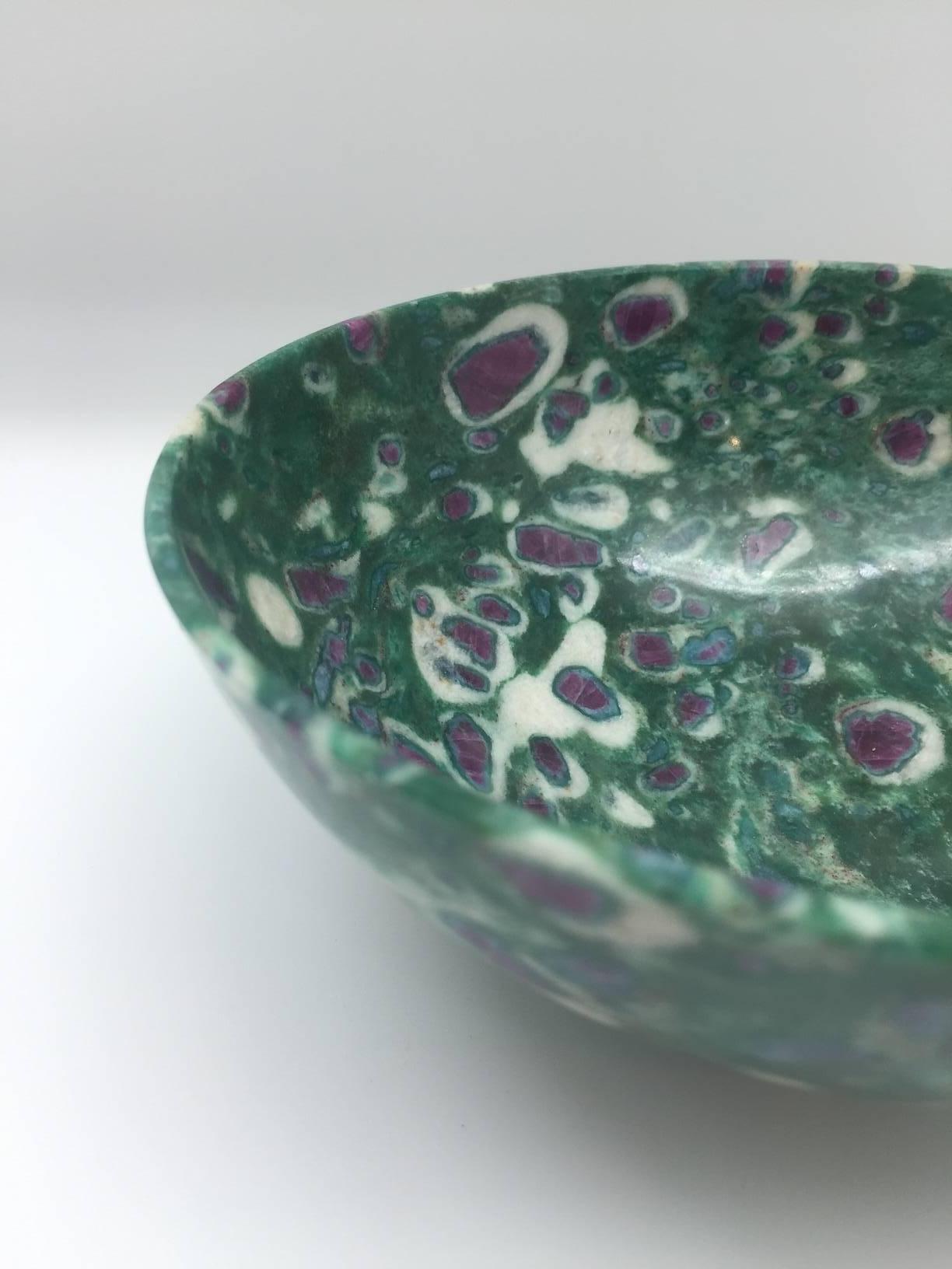Red ruby in green fuchsite semi-precious footed stone bowl. Fuchsite is a type of muscovite mica mineral which, in this case, has a higher level of chromium responsible for the beautiful green coloring. The red inclusions are corundum crystals also