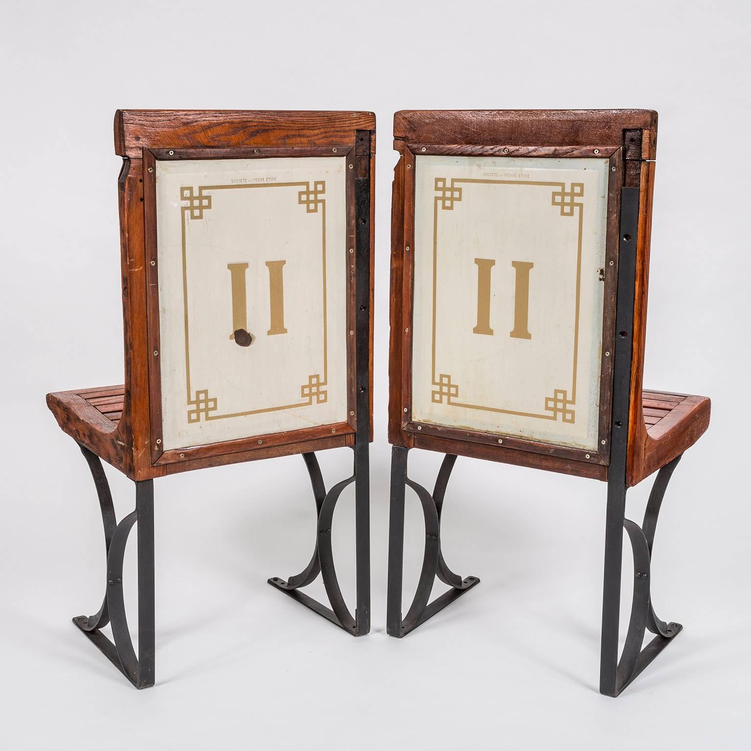 Pair of 1920s second class Paris Metro slatted wooden freestanding metro chairs with enamel backing inscribed 