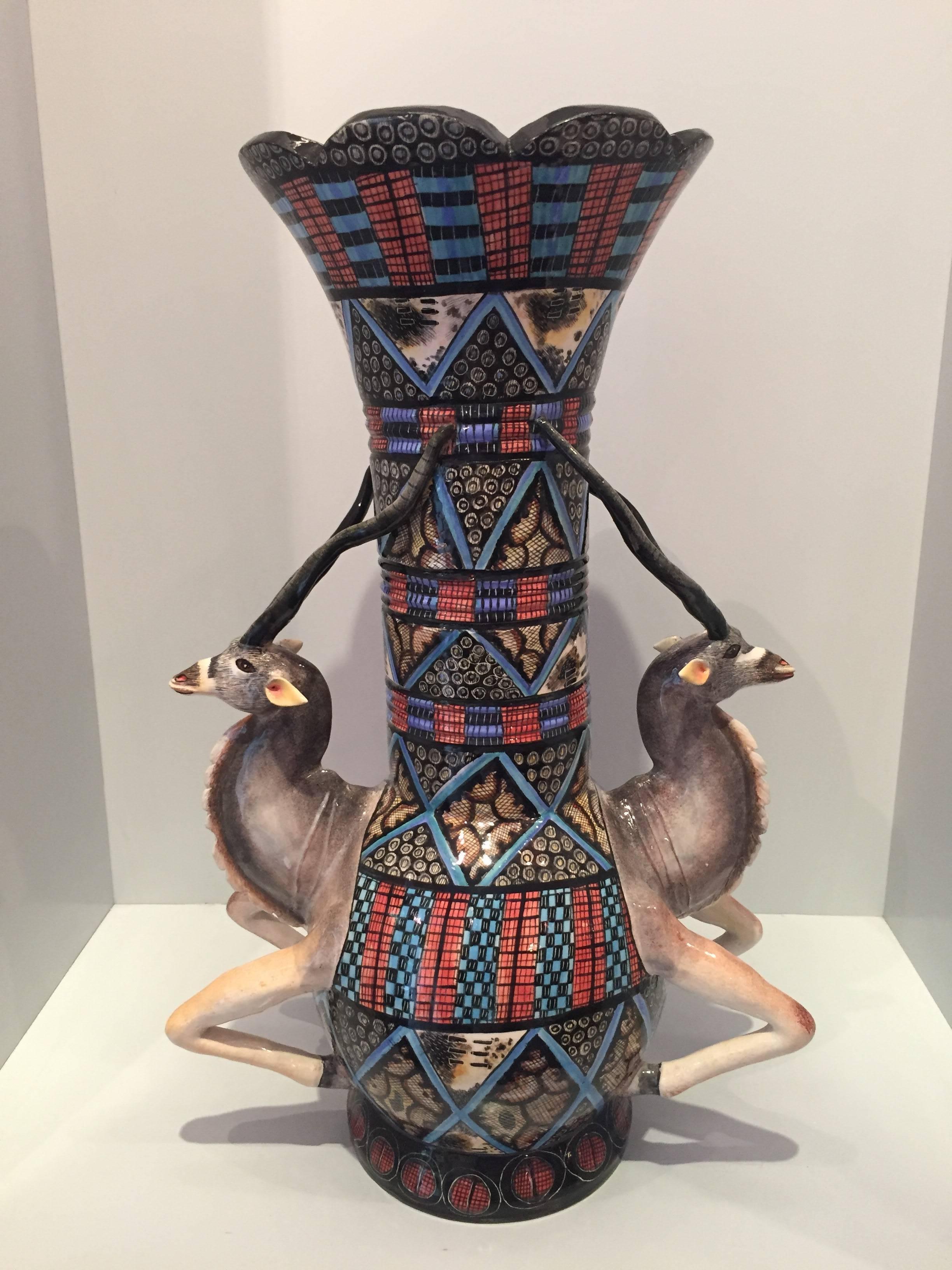 Kudu vase AAA, ceramic by Ardmore from South Africa. Sculpted by Sabelo Khoza, painted by Virginia Xaba. 

Ardmore ceramic art was established by Fee Halsted and is situated in the foothills of the Drakensberg Mountains of KwaZulu-Natal where