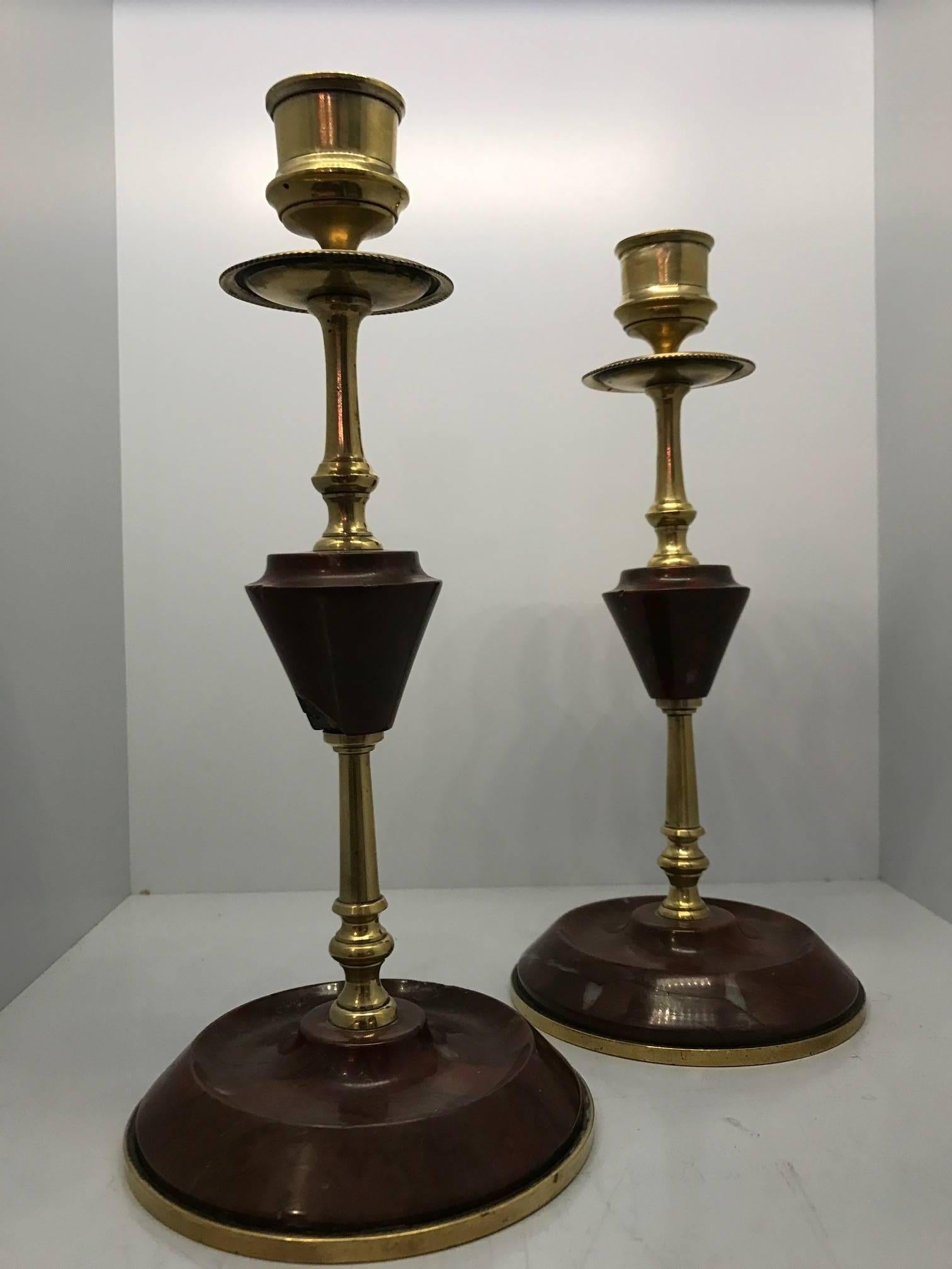 Beautiful pair of mid-20th century French red marble and brass candle sticks. Two small chips on the marble.