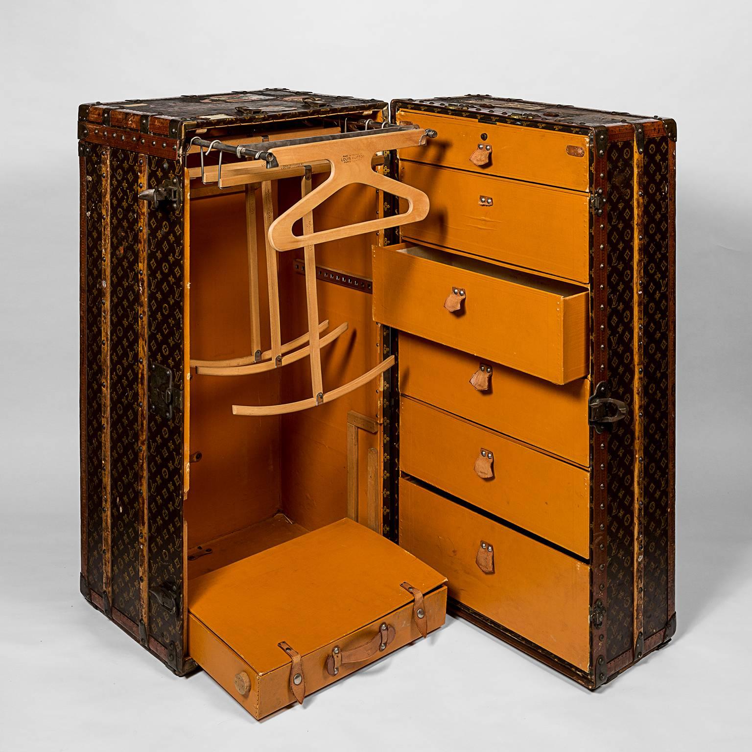 Louis Vuitton wardrobe trunk in monogram canvas; provenance the late Alexandra D. Gardiner Creel, owner of Gardiner's Island. Leather and brass bound, reinforced with wooden laths, the interior with hangers, dividers, a single drawer at the base of