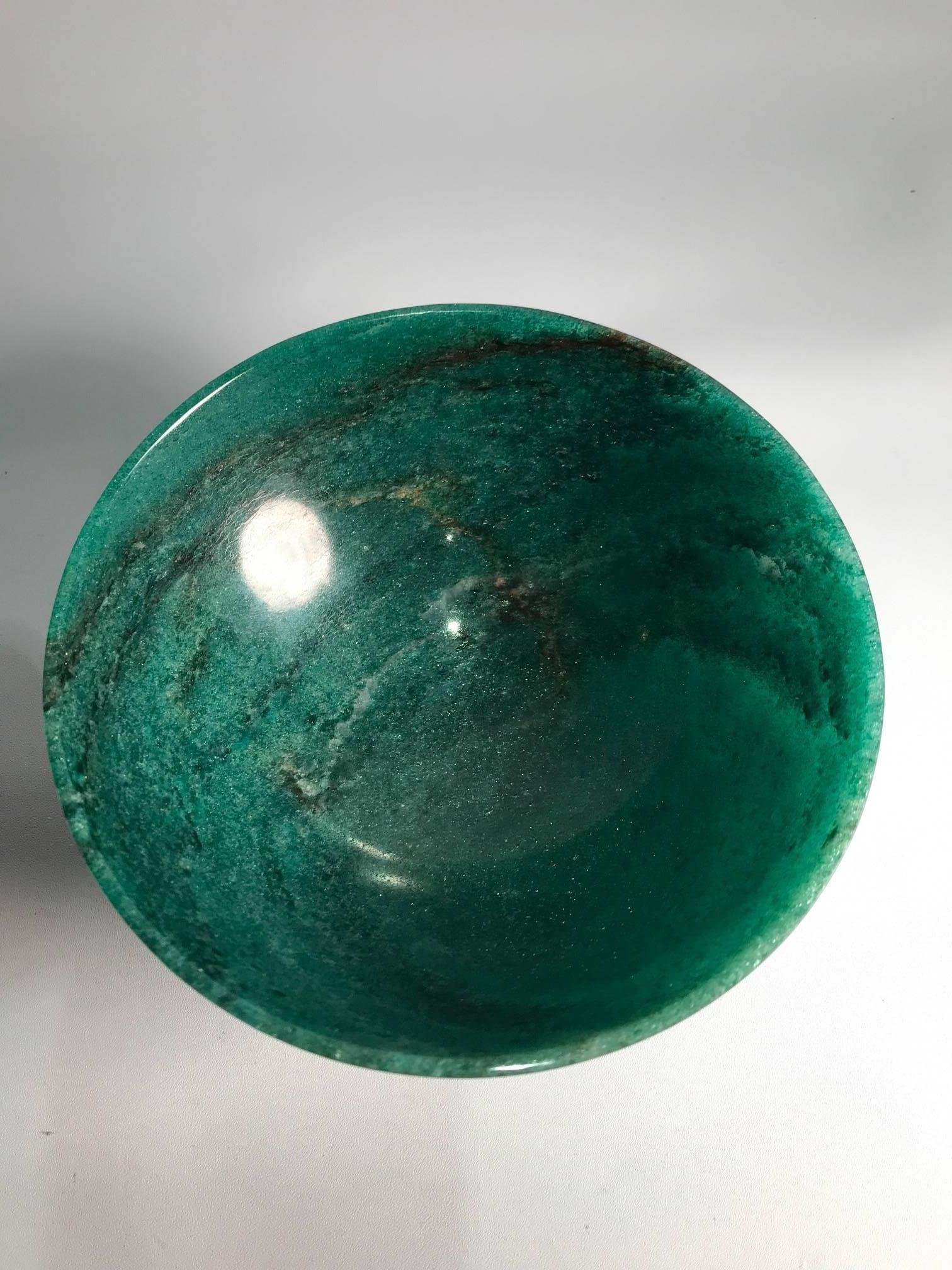 Hand-carved Aventurine Jade bowl from India. Aventurine is a form of quartz, characterized by its translucency and the presence of different layers of mineral inclusions that give a shimmering or glistening effect termed aventurescence.