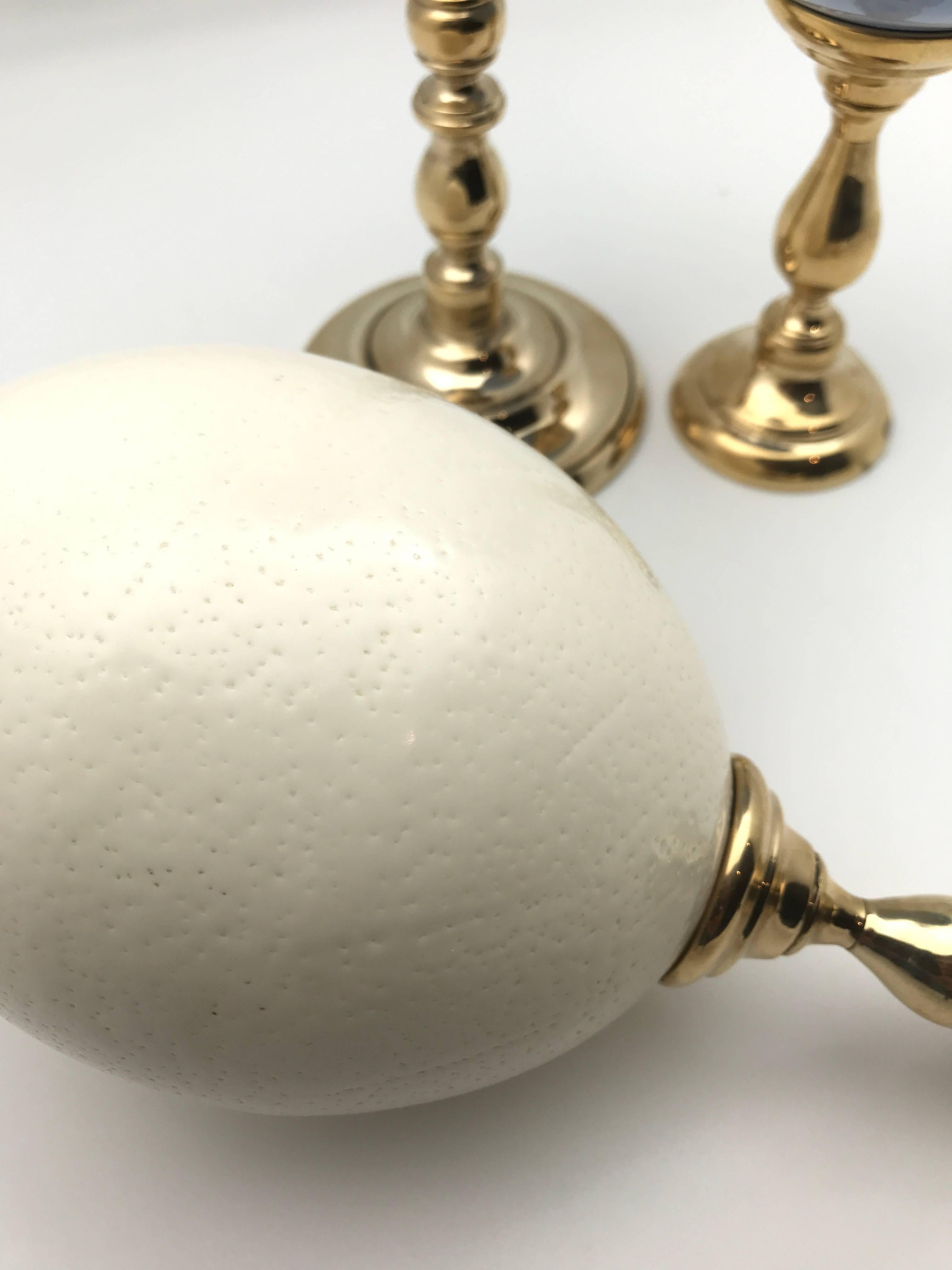 South African Lacquered and Natural Ostrich Eggs Mounted on Brass Bases