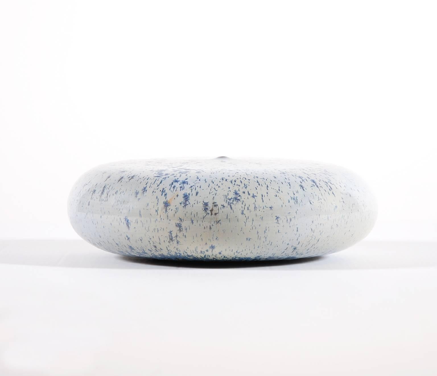 Ceramic sculpture by the Belgian ceramist Antonio Lampecco.

Round ceramic with crystallized enamel and a tiny aperture removing any function to the object.

An Humble Lampecco Quote:
My pots with tiny orifice have to be meaningless, I didn't