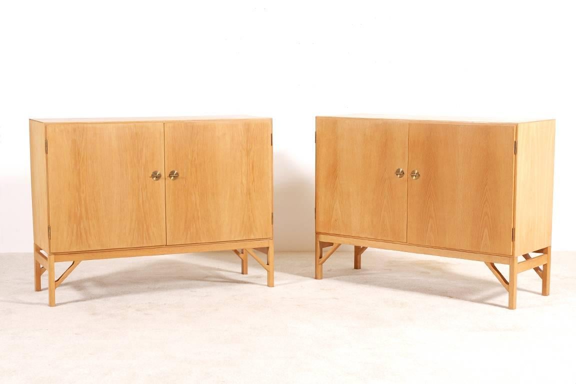 Børge Mogensen pair of double-door cabinets.
Produced by C. M. Madsens for FDB Møbler, 1960.
Excellent condition.

Can be sold only as a pair.

We ship worldwide. 
Express delivery in one week anywhere in the USA for 1500 Euros. (Full