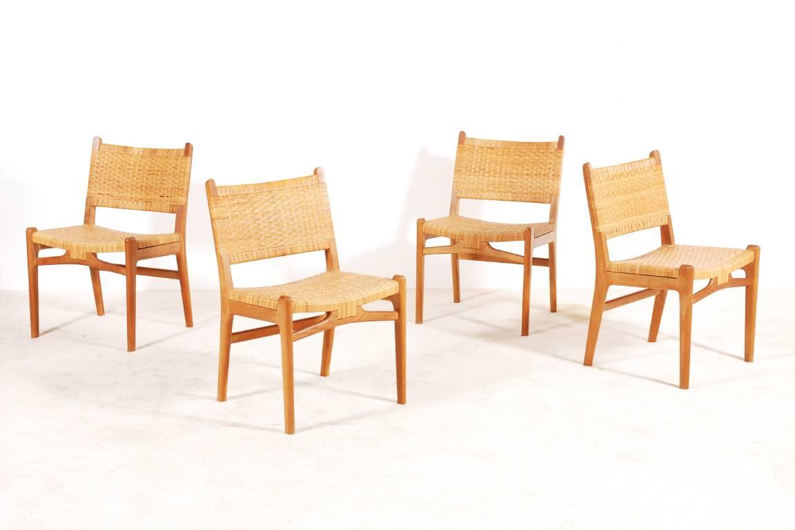 Set of four dining chairs model CH31 designed by Hans J. Wegner and produced by Carl Hansen, 
Denmark, 1956.
Excellent condition.

Rare with the original Cane.

We ship worldwide. 
Express delivery in one week anywhere in the USA for 750
