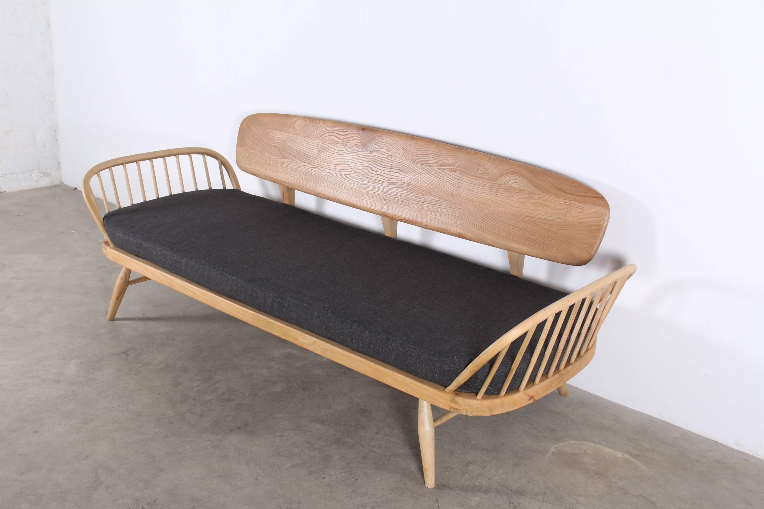 Elegant daybed, designed by Lucian Ercolani for Ercol, circa 1960. 
The frame was low-pressure blasted giving the beechwood a smart shine. 
New webbing, new fabric, re-upholstered. Perfect condition.
Also see our second similar model on the last