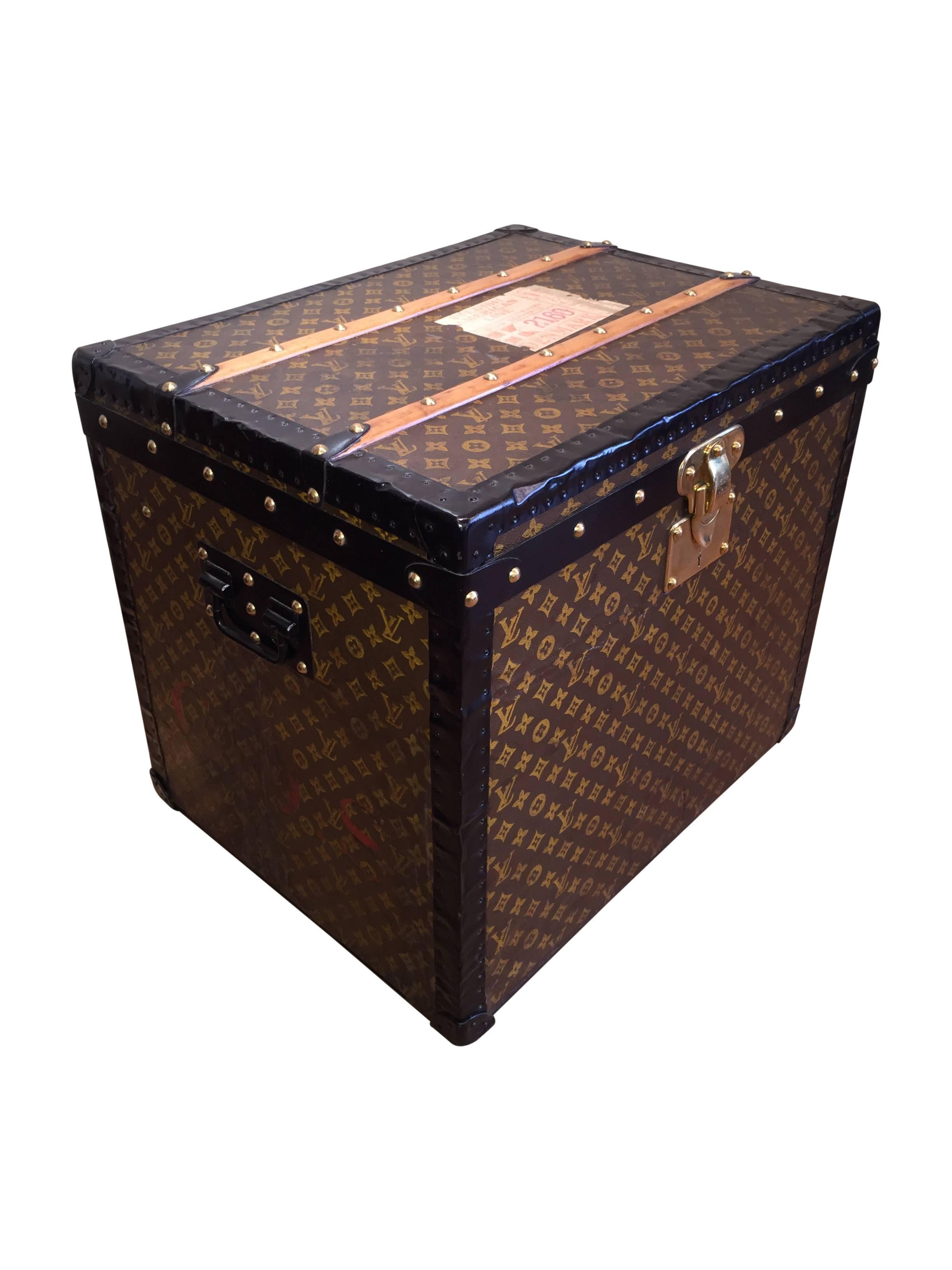 A gorgeous, circa 1910 steel bound Louis Vuitton hat box. This original piece is in wonderful condition for its age, still possessing its original interior trays and featuring a very resonant LV monogram. 

This size makes a wonderful end table.