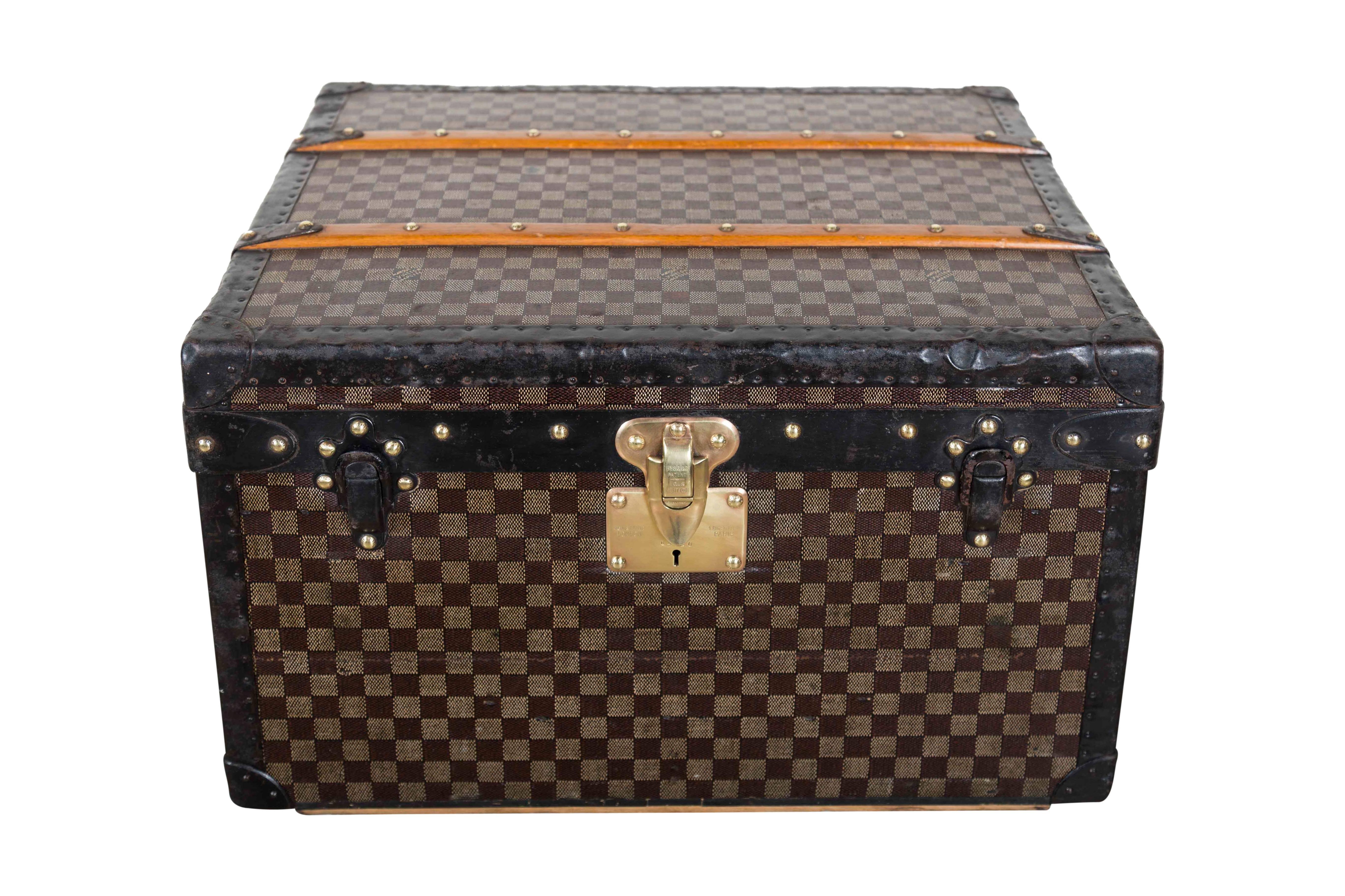 This is a Louis Vuitton custom monogramed boot case with original key and dust bag. The pattern is officially knowns as the Louis Vuitton Damier Ebene Cavnvas, and it was actually created in 1888, before the very recognizable monogram pattern. The