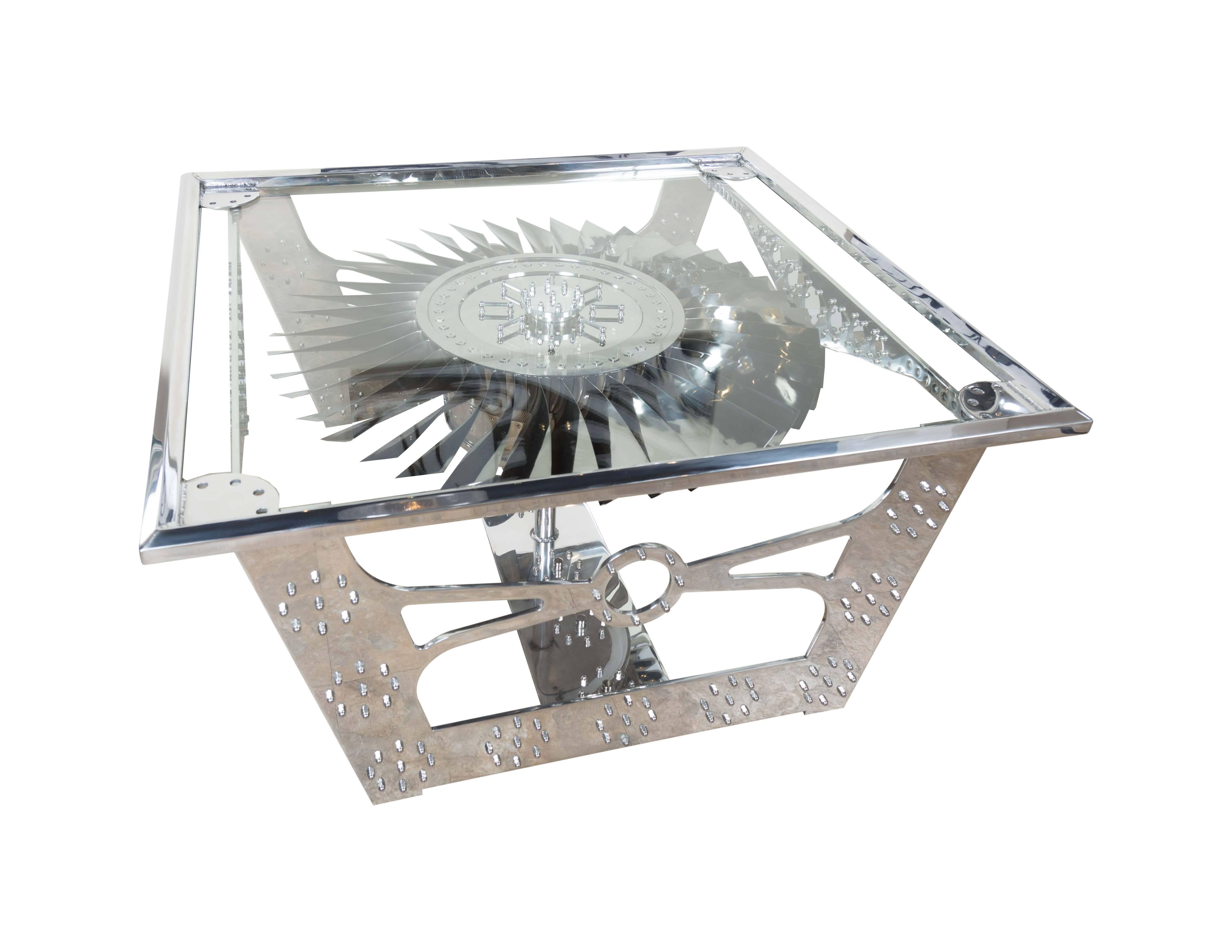 This custom motorized JT8D turbine table by Daniels Antiques draws those who pass by! There are many elements that make this more than just a table, it is a true piece of art. The main feature of the table is comprised of a motorized and hand