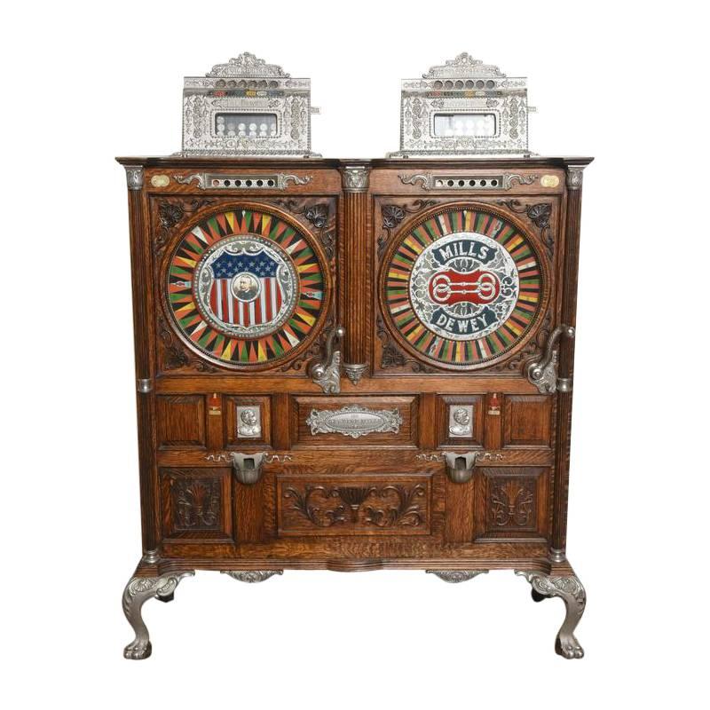 The Mills Double Dewey Slot machine was crafted by the Mills Novelty Co. of Chicago, Illinois in 1906. This particular machine arrived on a horse-drawn carriage to a private club in Aspen, Colorado. While most slot machines were destroyed during