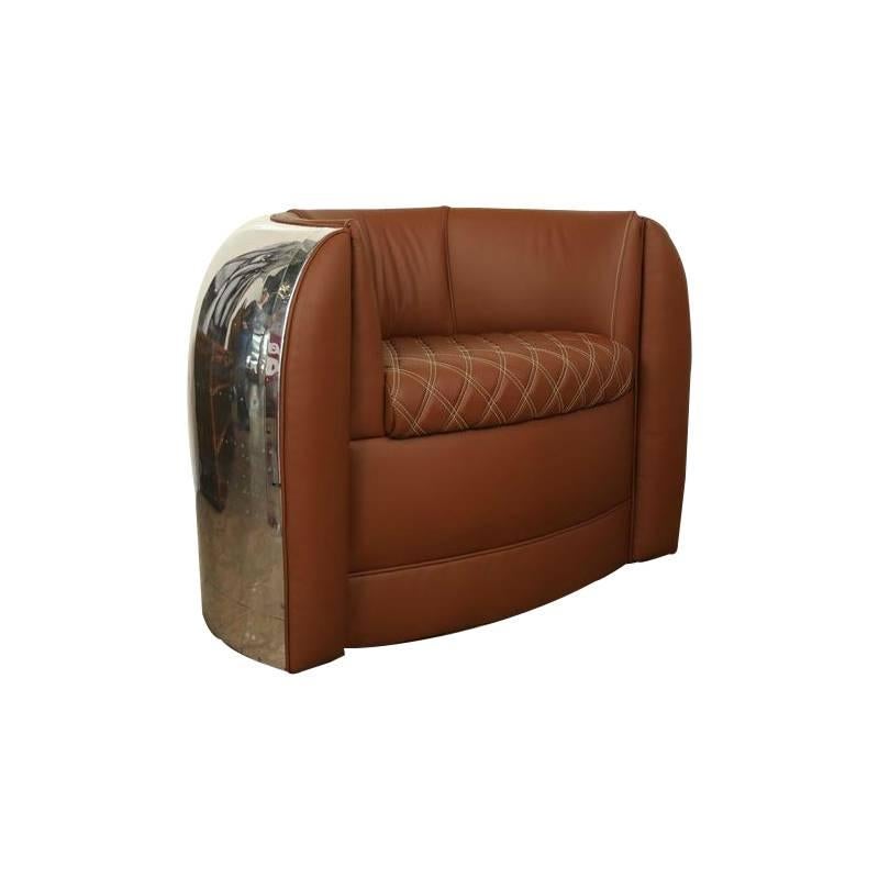 This beautiful custom built piece is the polished cowling from a Douglas Aircraft. The rich chocolate brown leather and stitching used creates a beautiful and elegant contrast between the sleek and shiny body of the cowling. There is an element of