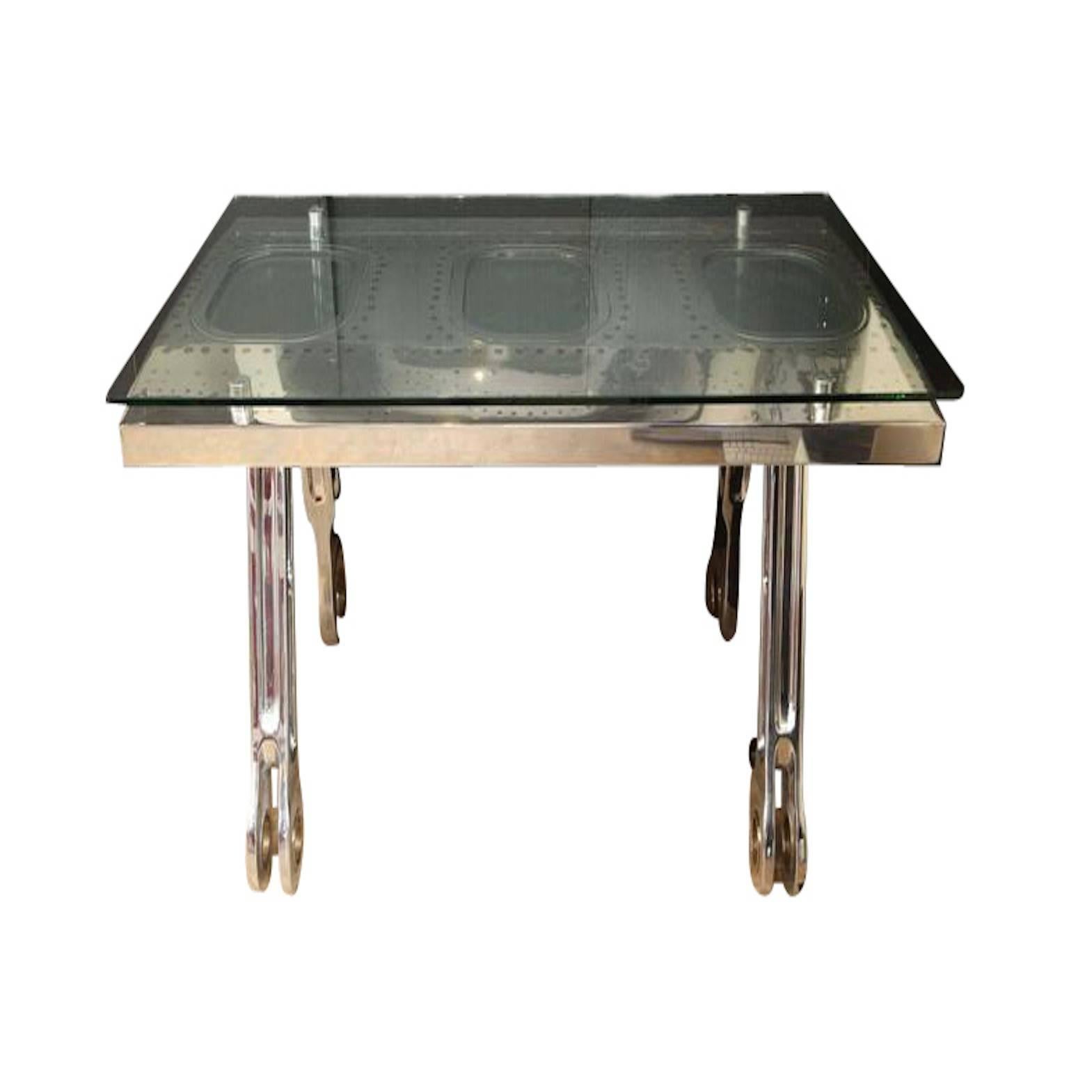 This desk consists of three windows cut from the side of a Boeing 747 plane, and the base of the desk is the landing gear. It is sure to be the statement piece in any office setting.
 