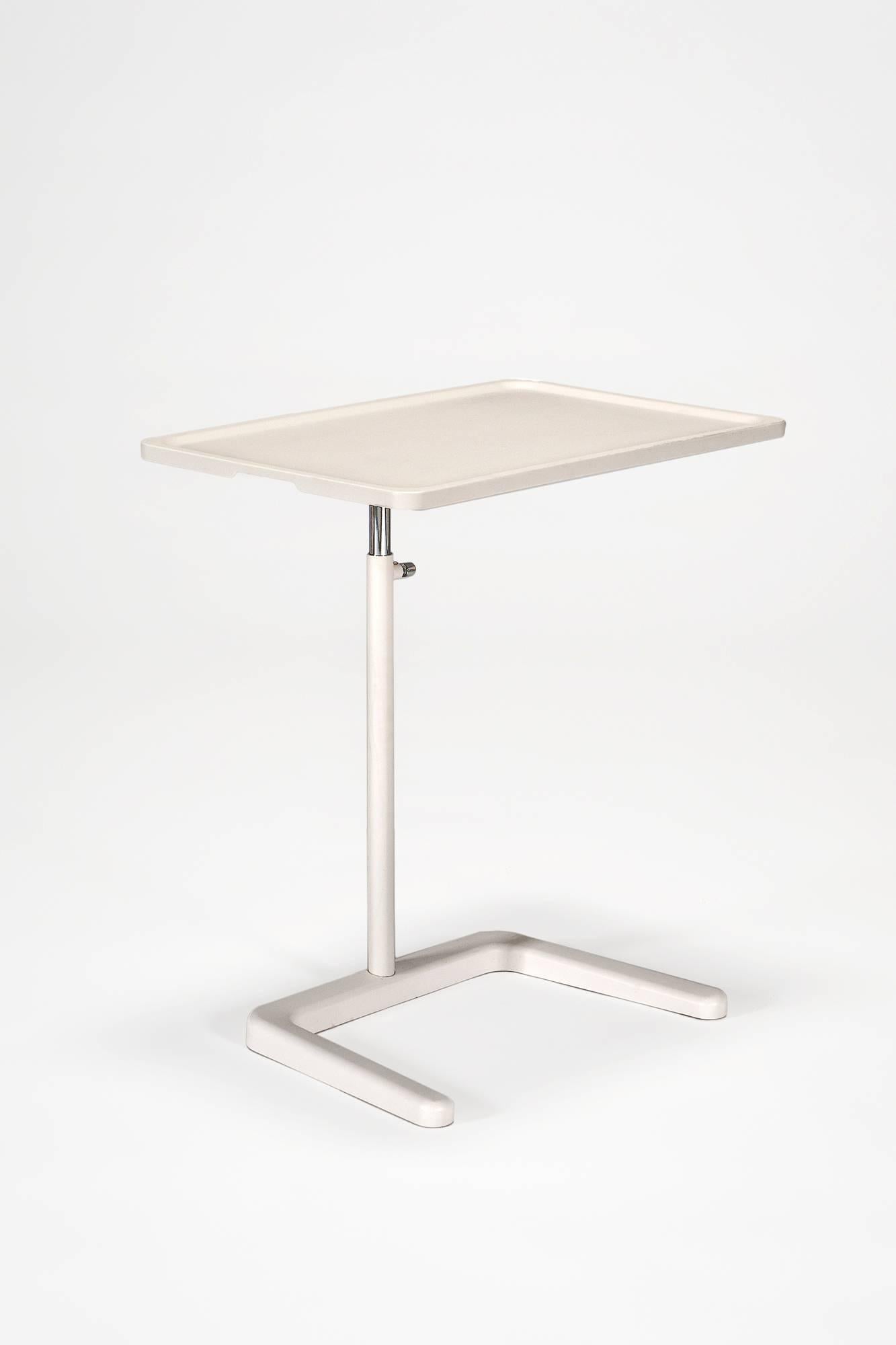 Adjustable occasional table designed for multiple uses. The surface of this occasional table is height and tilt adjustable, perfect for laptop use, making it possible to maintain a correct ergonomic working posture, even while working from a sofa or