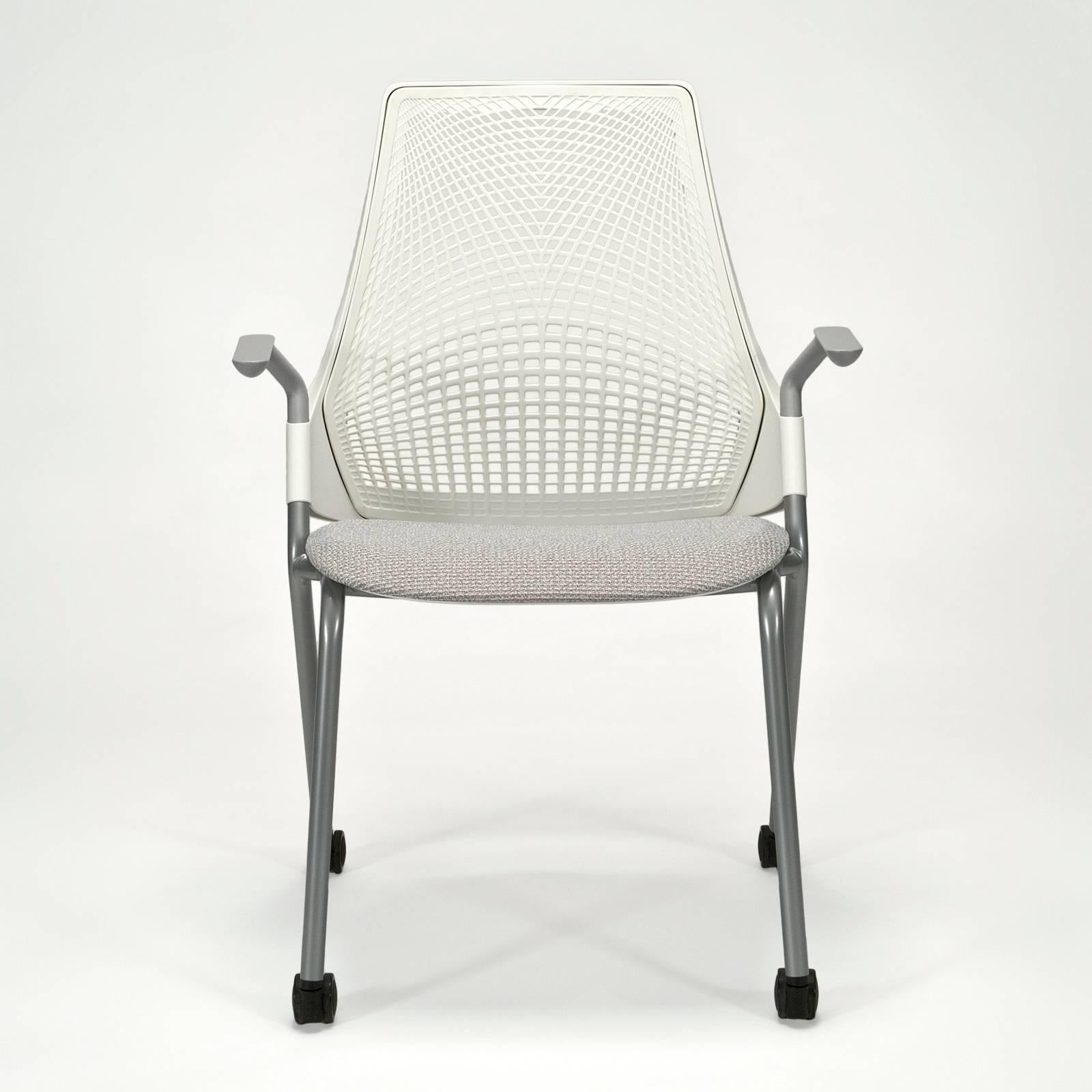 Six available -Brand new with original protective wrapping and consumer labels still attached. All chairs come with tilt lifter allowing adjustment to both tilt tension and range (four settings). These examples in studio white with fog upholstery.