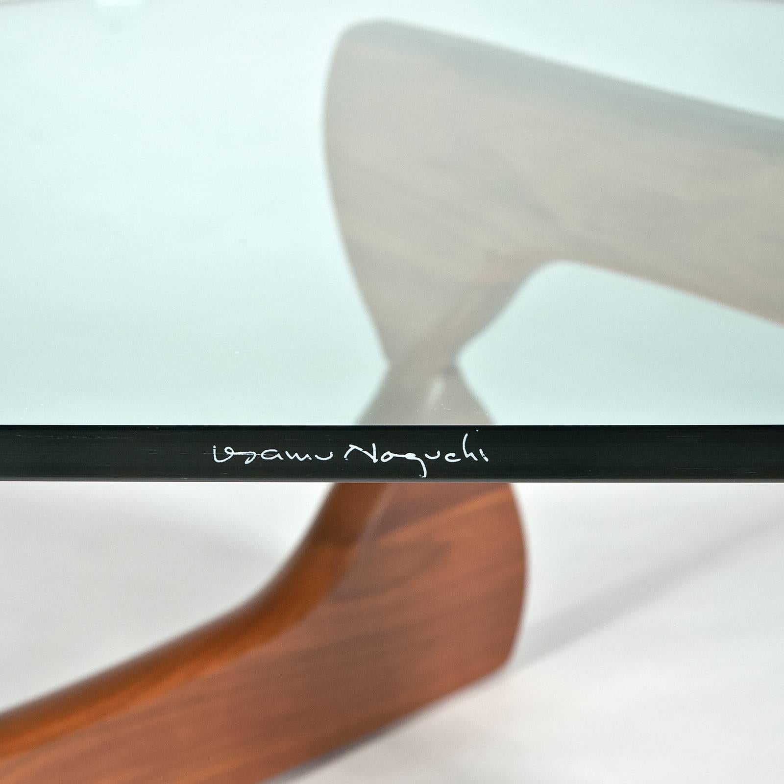 Designed in 1948. Made in the USA. Authentic table by Herman Miller. Note signature tag on bottom of base and etched signature on edge of glass. From circa 2010 production in very good condition with wear consistent with age.

An iconic table