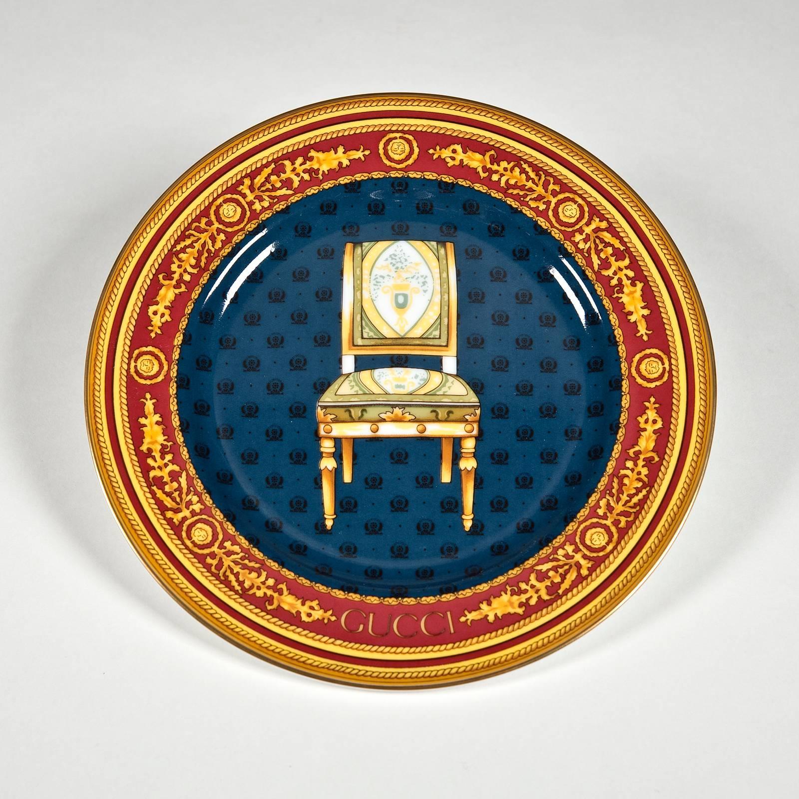 Porcelain with signature Gucci details including gilt gold tops, and gilt edging with gold rope motif and Gucci Vermillion accents. A fine gold line delineates the tops of the serving pieces and the edges of the plates. Side views of four different