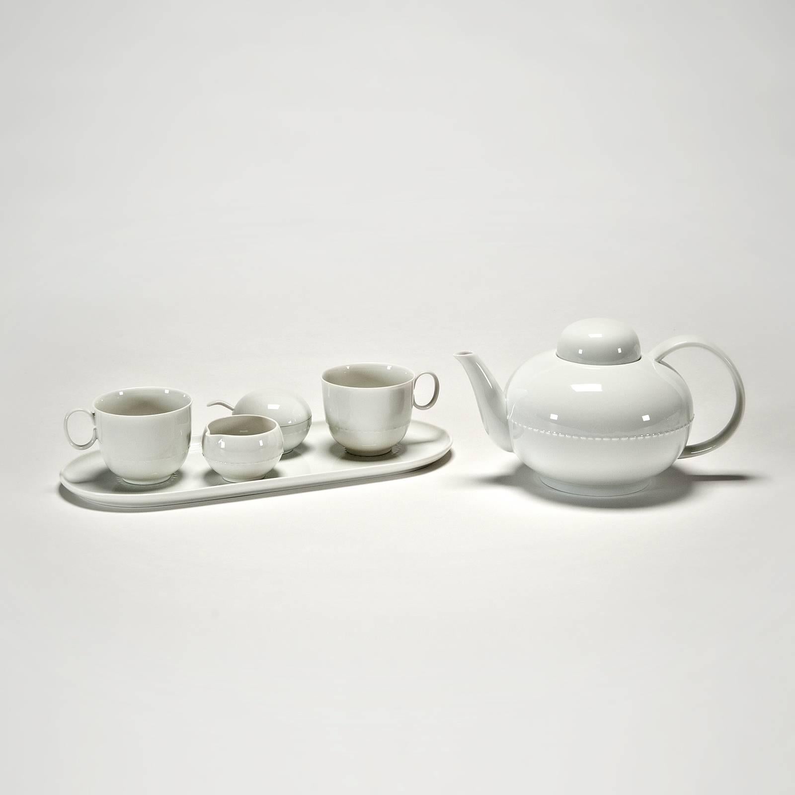 Teapot: 5.5" h with lid x 9" x 6", Warmer: 3" h x 6 diameter, cups: 2.5" h x 3" x 4", creamer: 1.75" h x 2.5" x 2.25", sugar bowl: 2" h with lid, 2.5" diameter, sugar spoon: 3.25" x
