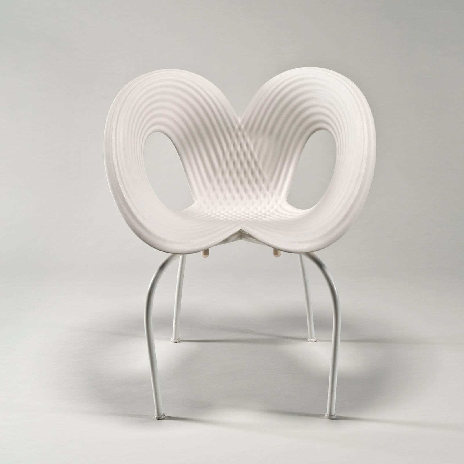 The chair was designed for indoor/outdoor use and is stackable. (This hand-signed version not recommended for outdoors.) Excellent condition. Only one available.

The shell of the chair is injection molded with a relief design in a figure eight