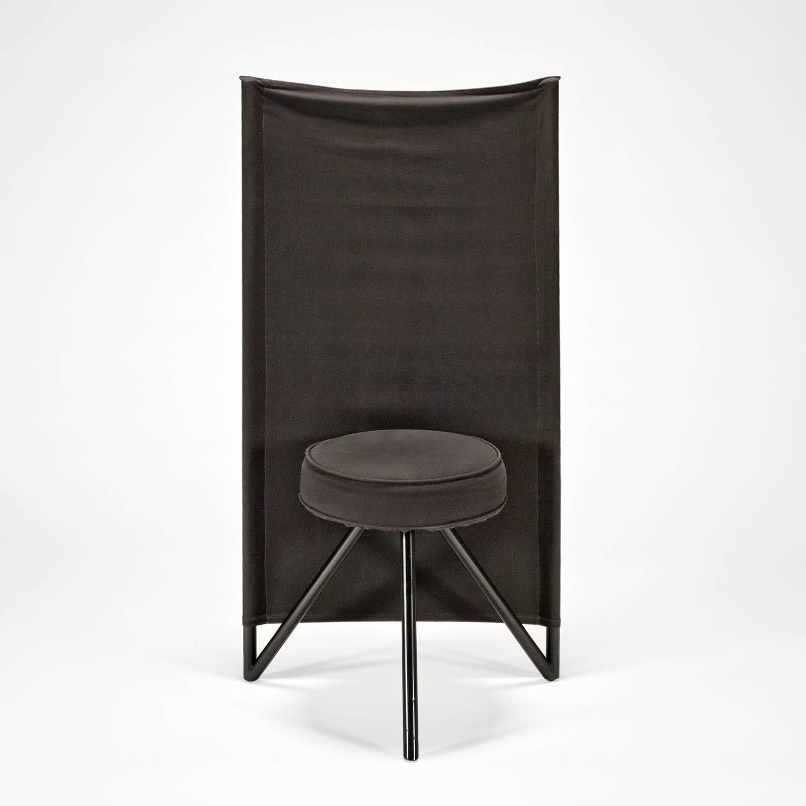 From 1982-1983 production. Black cotton canvas fabric is stretched over two vertical steel tubes and the tension creates the comfortable back of the chair. The seat has a matching cotton canvas cover cinched under the seat with black cotton ties.