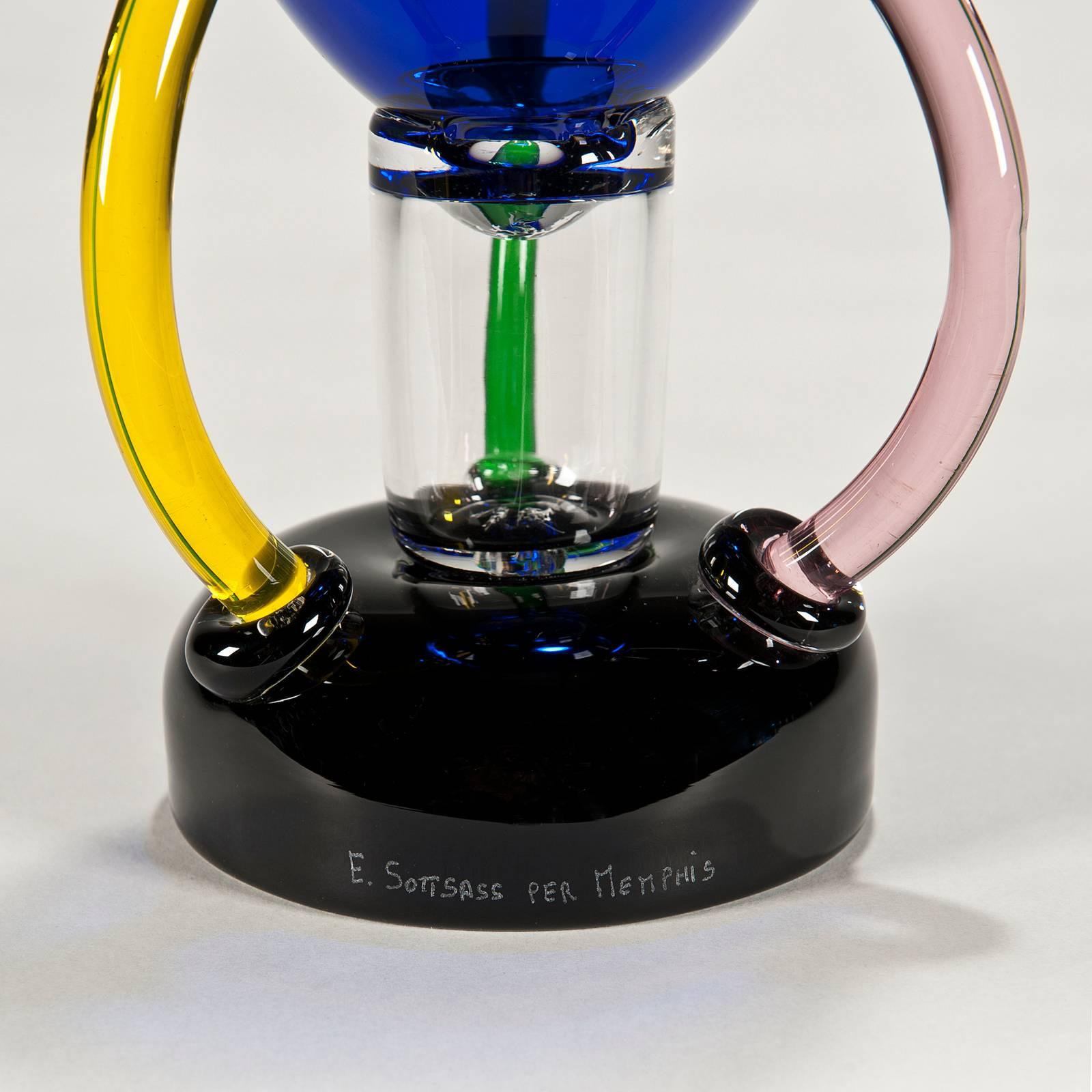 Signed E. Sottsass 1982 per Memphis on black glass base. Brand new in original crate. 

Murano, a tiny island near Venice, has been the historic repository of Italy's glassmaking tradition, closed for centuries to protect its legendary techniques.