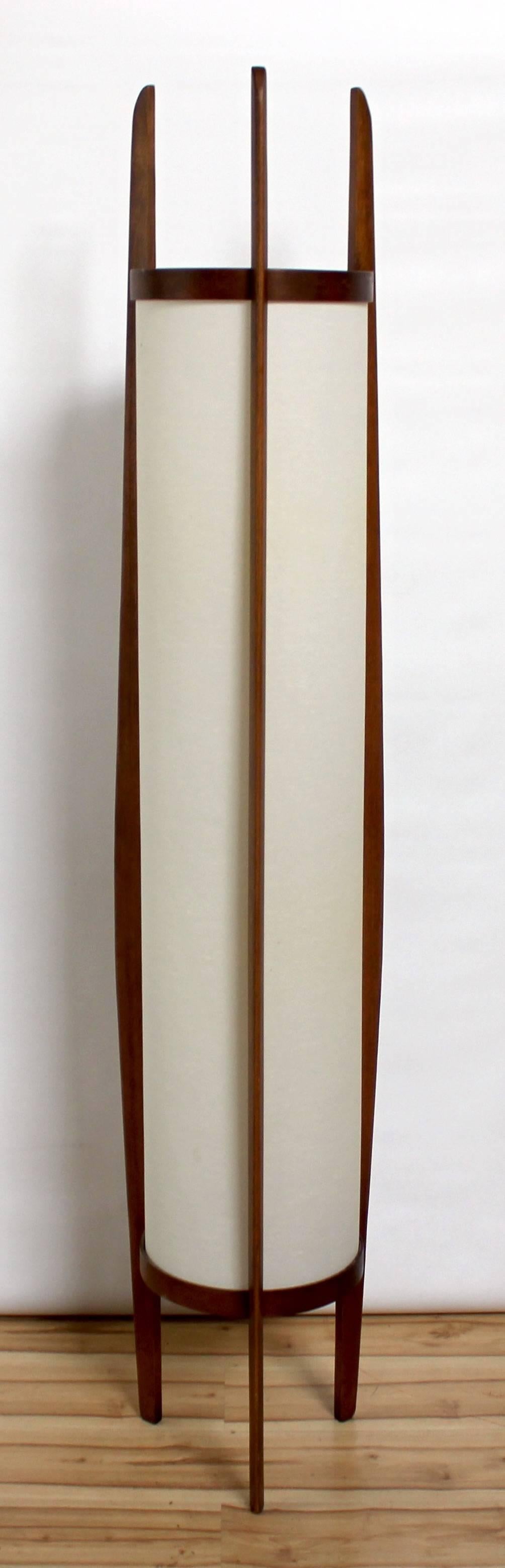 1960s Danish Modern sculptural teak floor lamp by Modeline with large linen drum shade. Lamp stands 6' tall and takes two light bulbs.