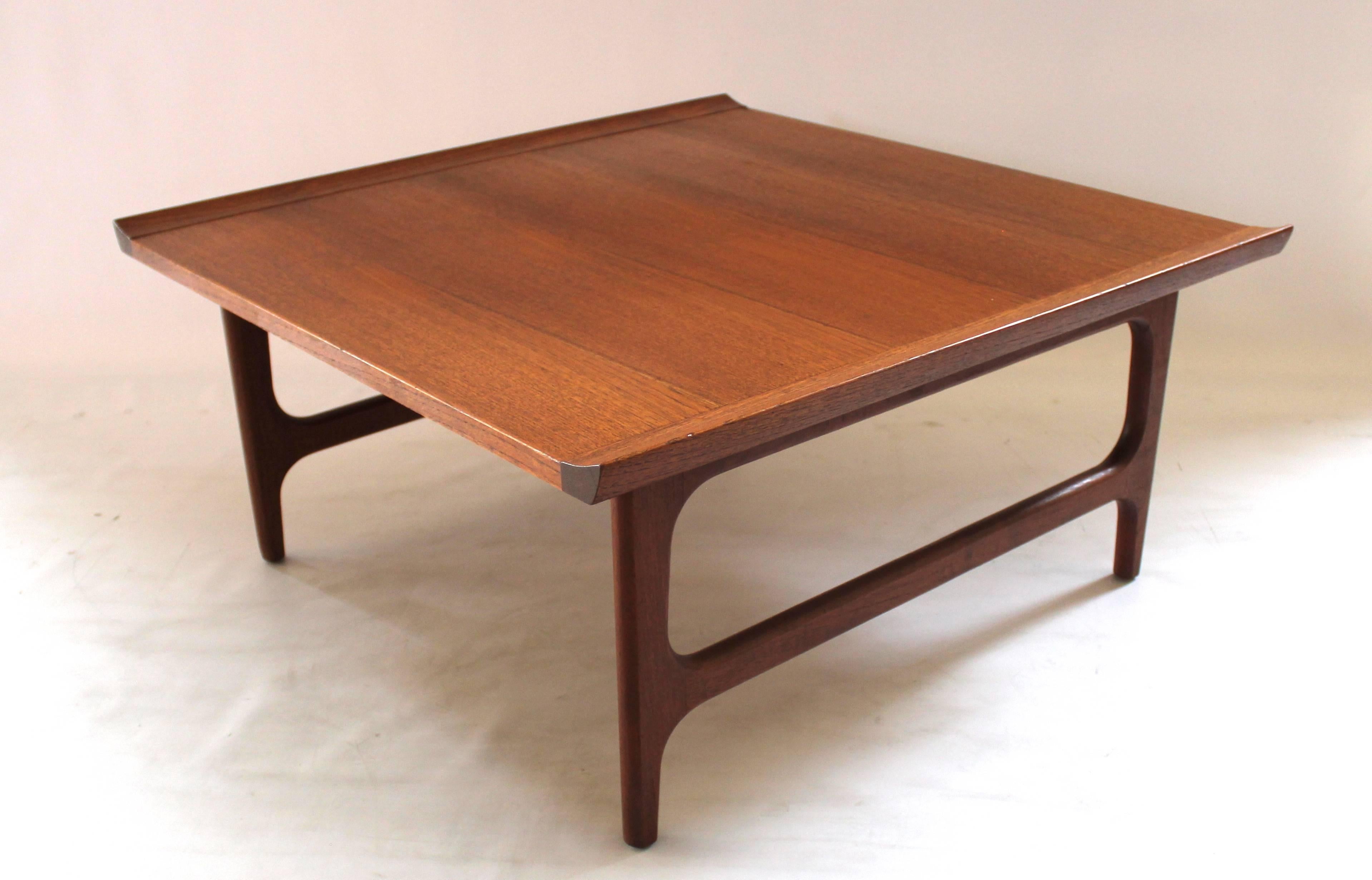 1960s Japanese Modern teak coffee table in the style of Finn Juhl. Marked "Made in Japan."