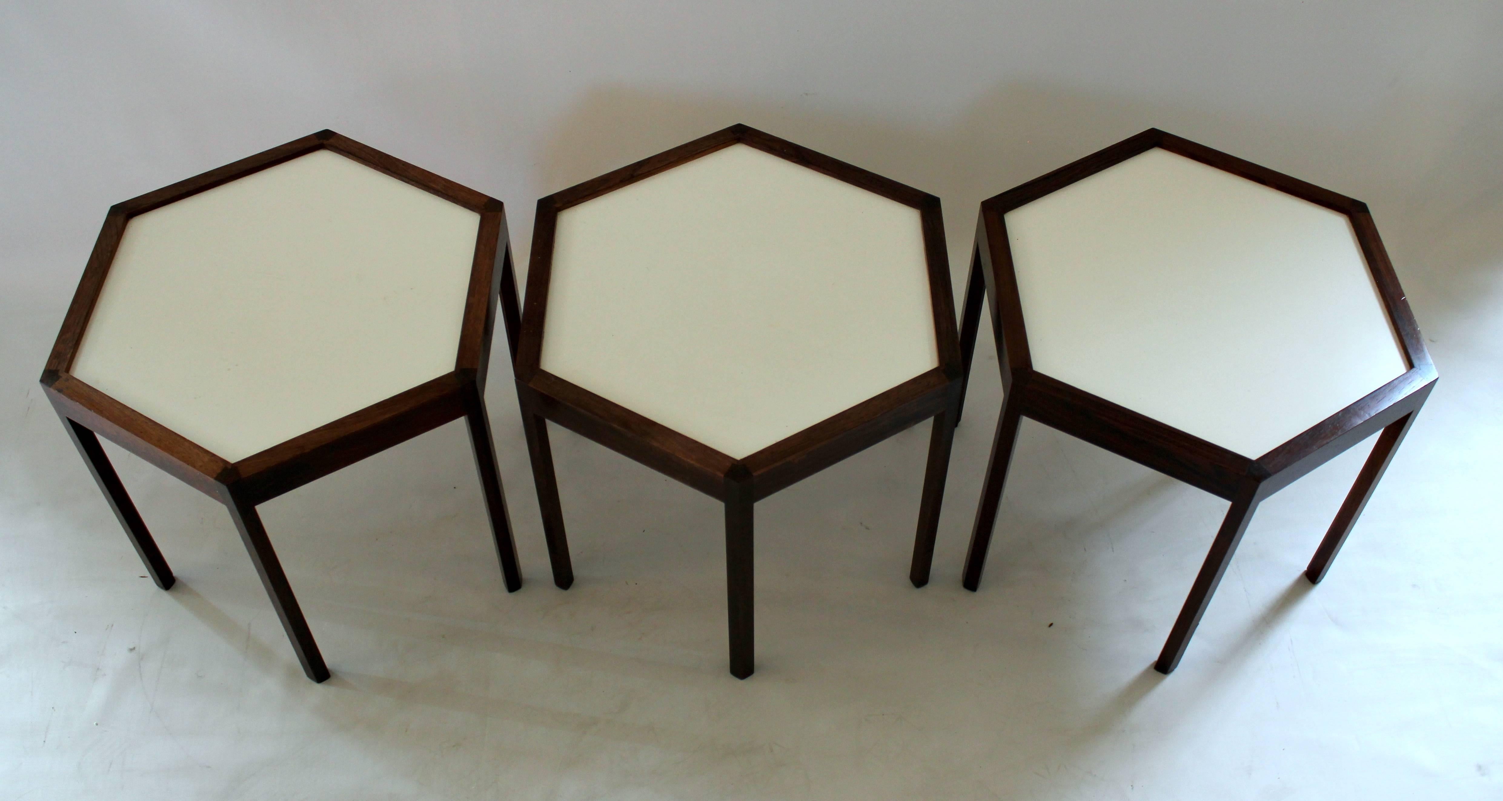 Set of three 1960s Danish Modern rosewood and white laminate side tables designed by Hans C. Andersen for Silkeborg Mobelfabrik, price is for the set.