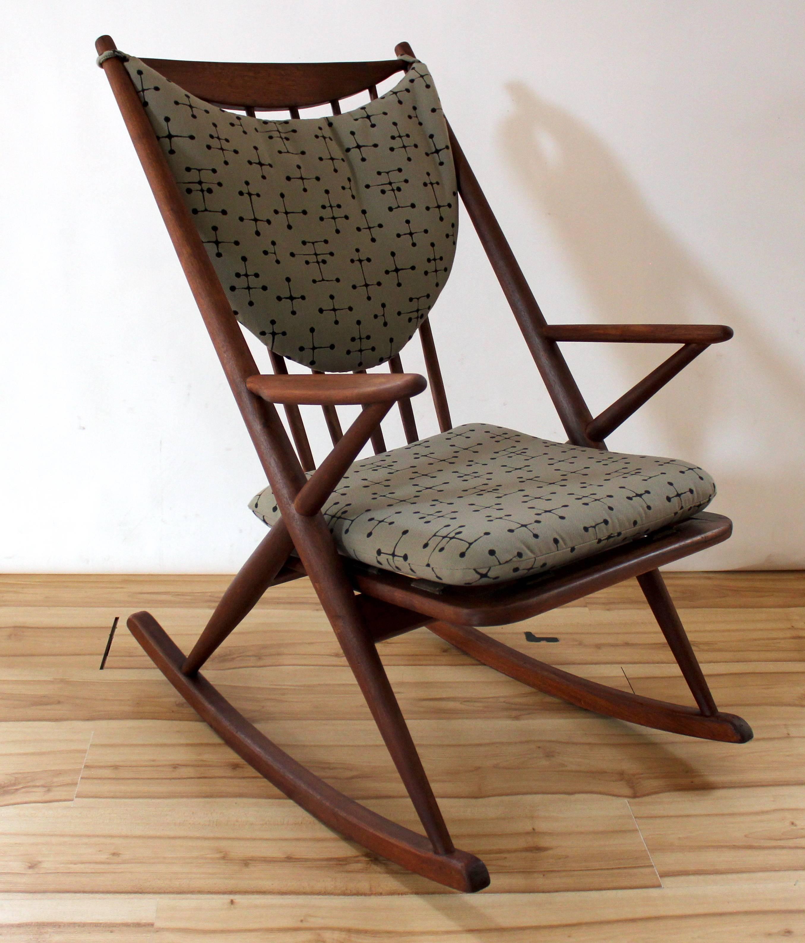 1960s Danish modern teak rocking chair designed by Frank Reenskaug for Bramin Mobler. Seat and back pad have been professionally reupholstered in Eames dot fabric.