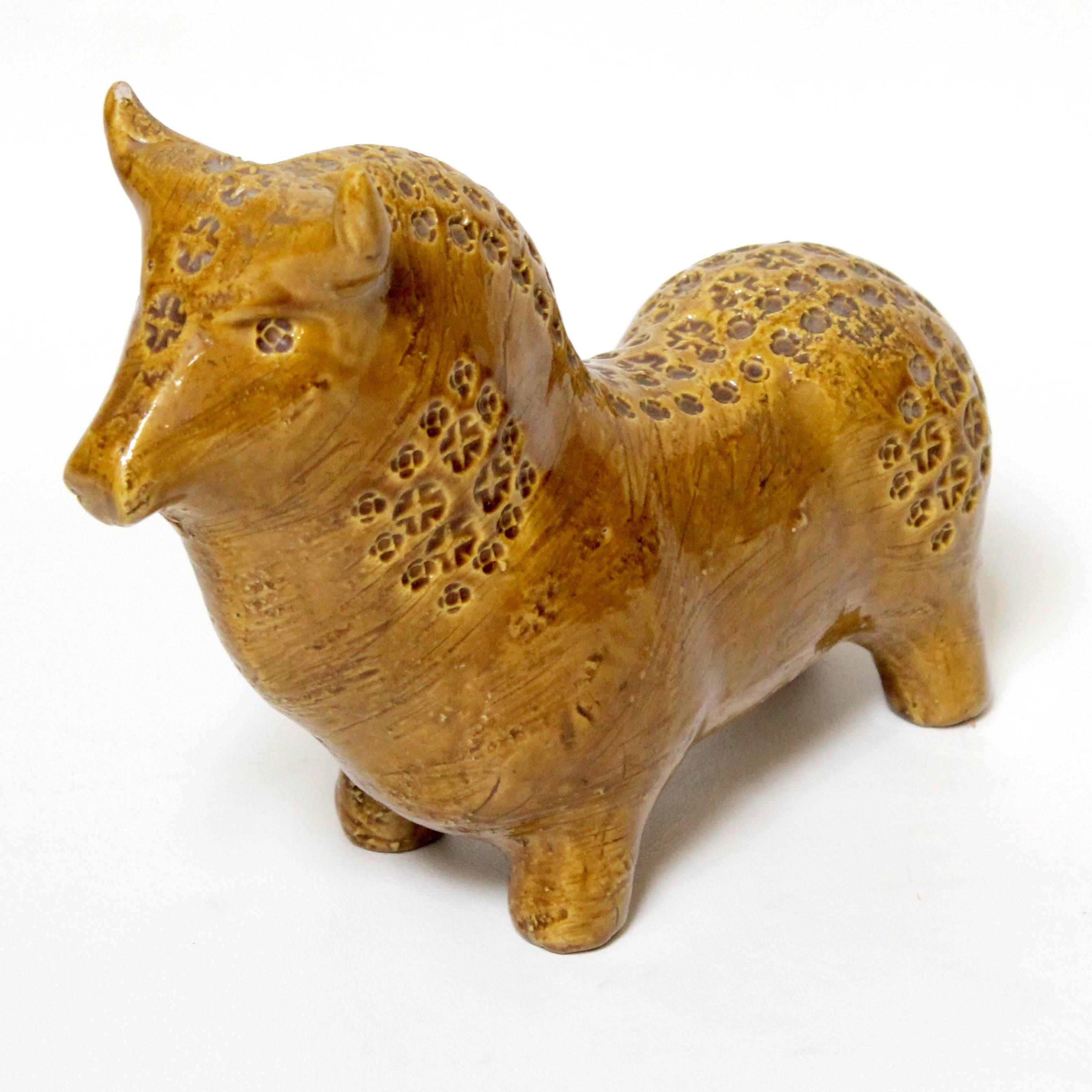 Mid-Century Modern ceramic bull statue designed by Aldo Londi for Bitossi, Italy, with flower pattern. An appealing mod design, in excellent condition with slight wear to finish on one Horn.
