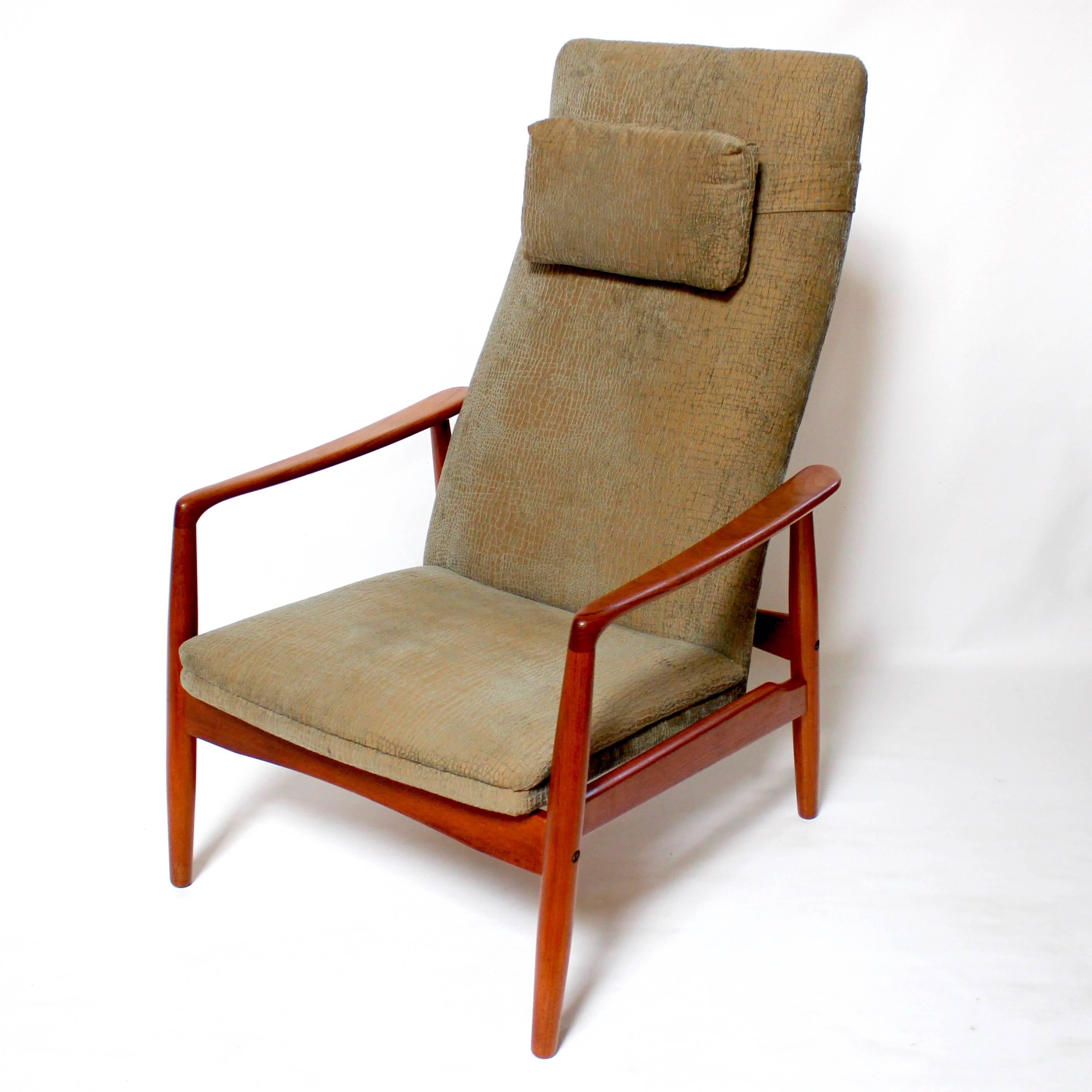 Danish Modern teak-framed lounge chair and ottoman by Søren Ladefoged, circa 1960. The lounge chair features a high back and detachable headrest, and reclines. Both the chair and ottoman are in excellent condition, and have been recently upholstered