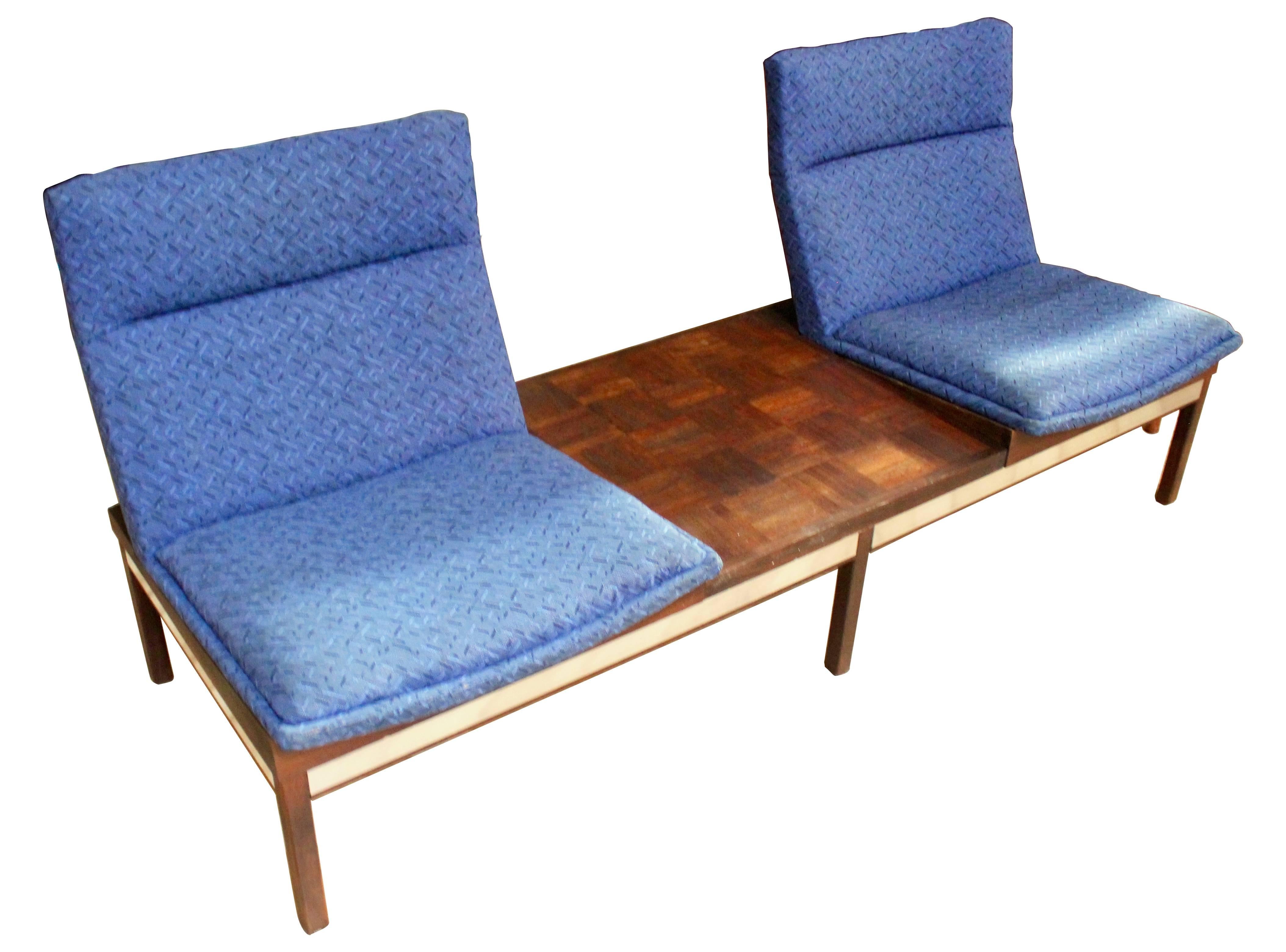 Mid-Century modular dimension 28 sofa and chair set by Arthur Umanoff for Madison Furniture Industries. The sofa is modular, with the two seats and walnut parquet panel able to be reconfigured. Both the sofa and chair have walnut frames with