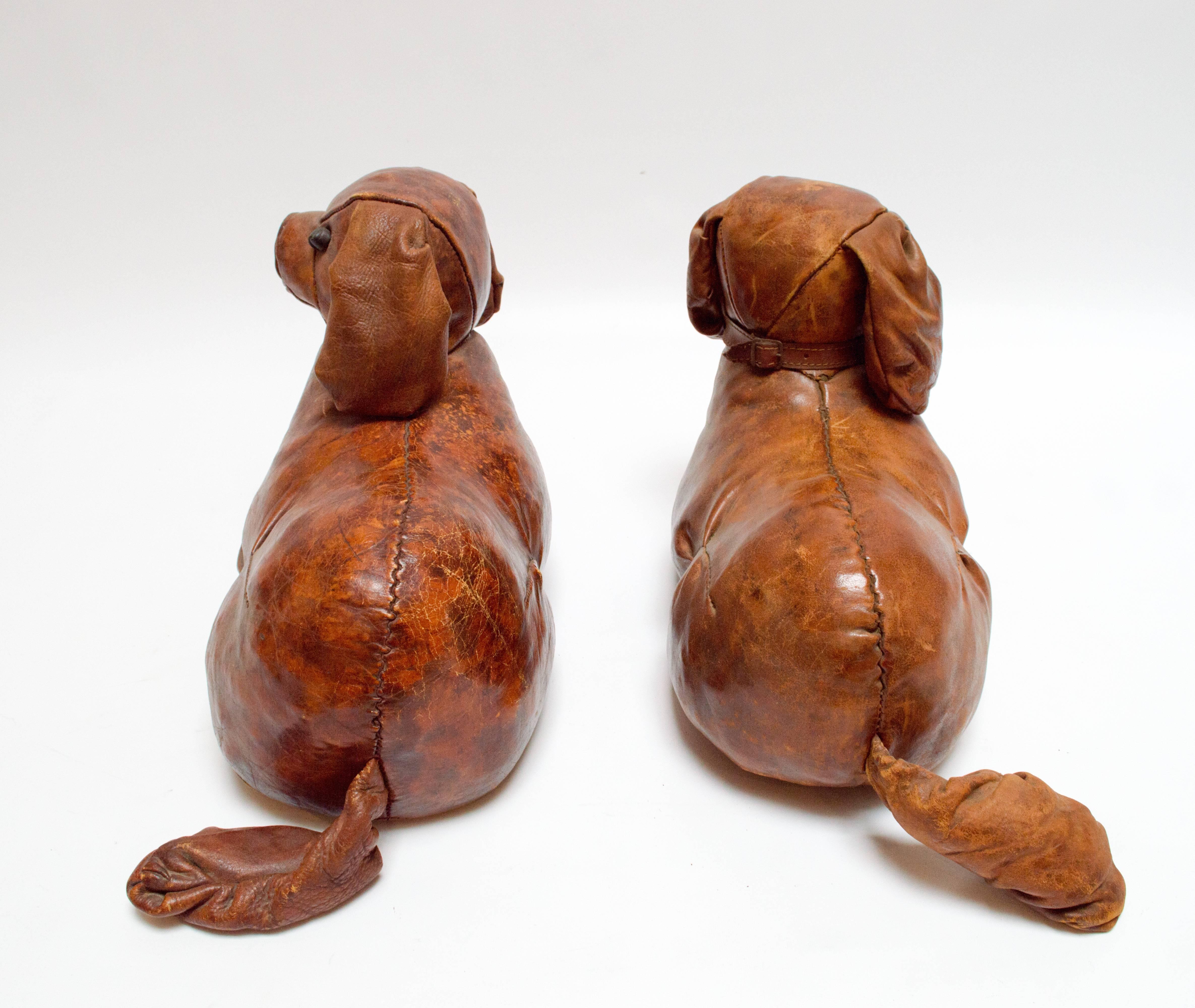 Pair of leather King Charles Cocker Spaniels designed by Dimitri Omersa for Abercrombie & Fitch, circa 1950. Price is for the pair.