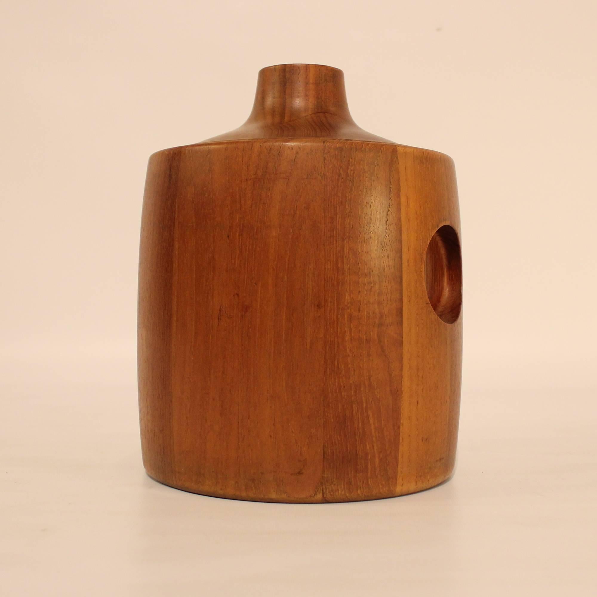 1960s Danish Modern teak ice bucket with black plastic insulating liner. Designed by Henning Koppel for Georg Jensen in the 1960s, and marked with Koppel's signature and the Georg Jensen company mark.