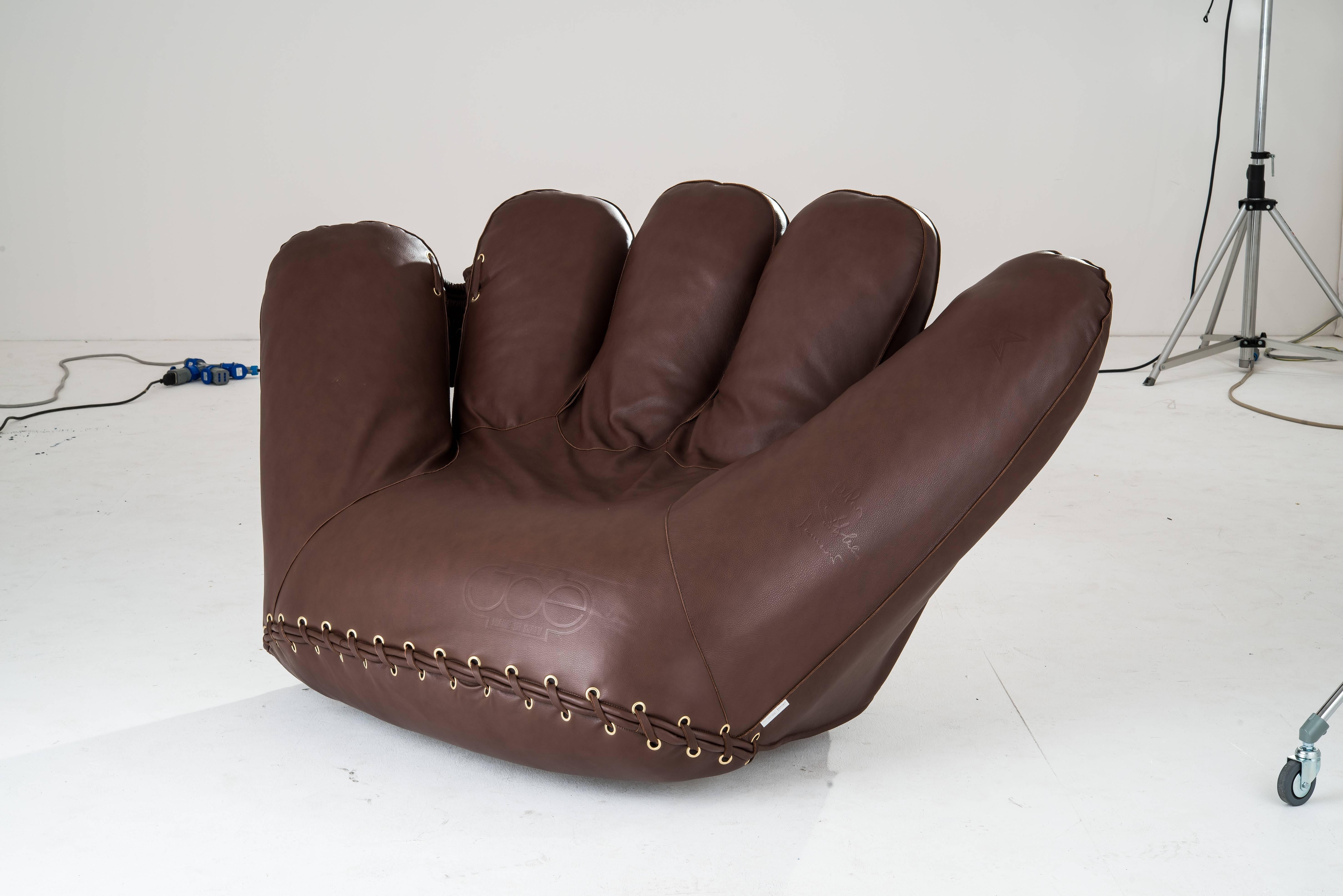 Joe Glove Armchair (1970). 
De Pas, D'Urbino & Lomazzi (Italy) / Poltronova.
(Dedicated to Joe DiMaggio) / steel frame, preformed polyurethane foam padding.
leather upholstery, hidden swivel mechanism.
Dimensions: W 175 x H 95 x D 110 cm.

An