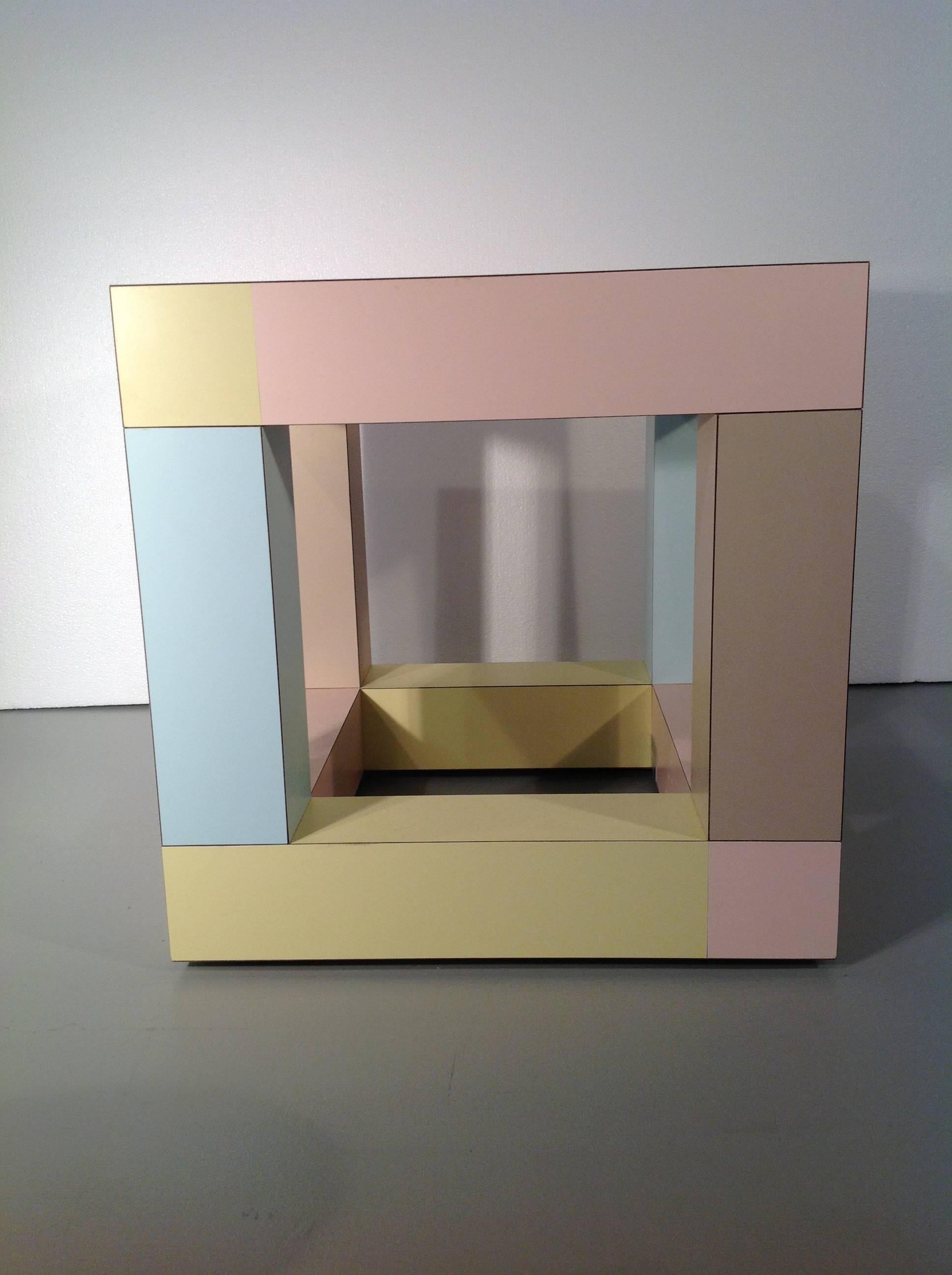 Mimosa end table by Ettore Sottsass for Memphis srl (1984)

A small end table in plastic laminates (different colors) with glass inset top / a perfect example of Sottsass's Masterly usage of color.