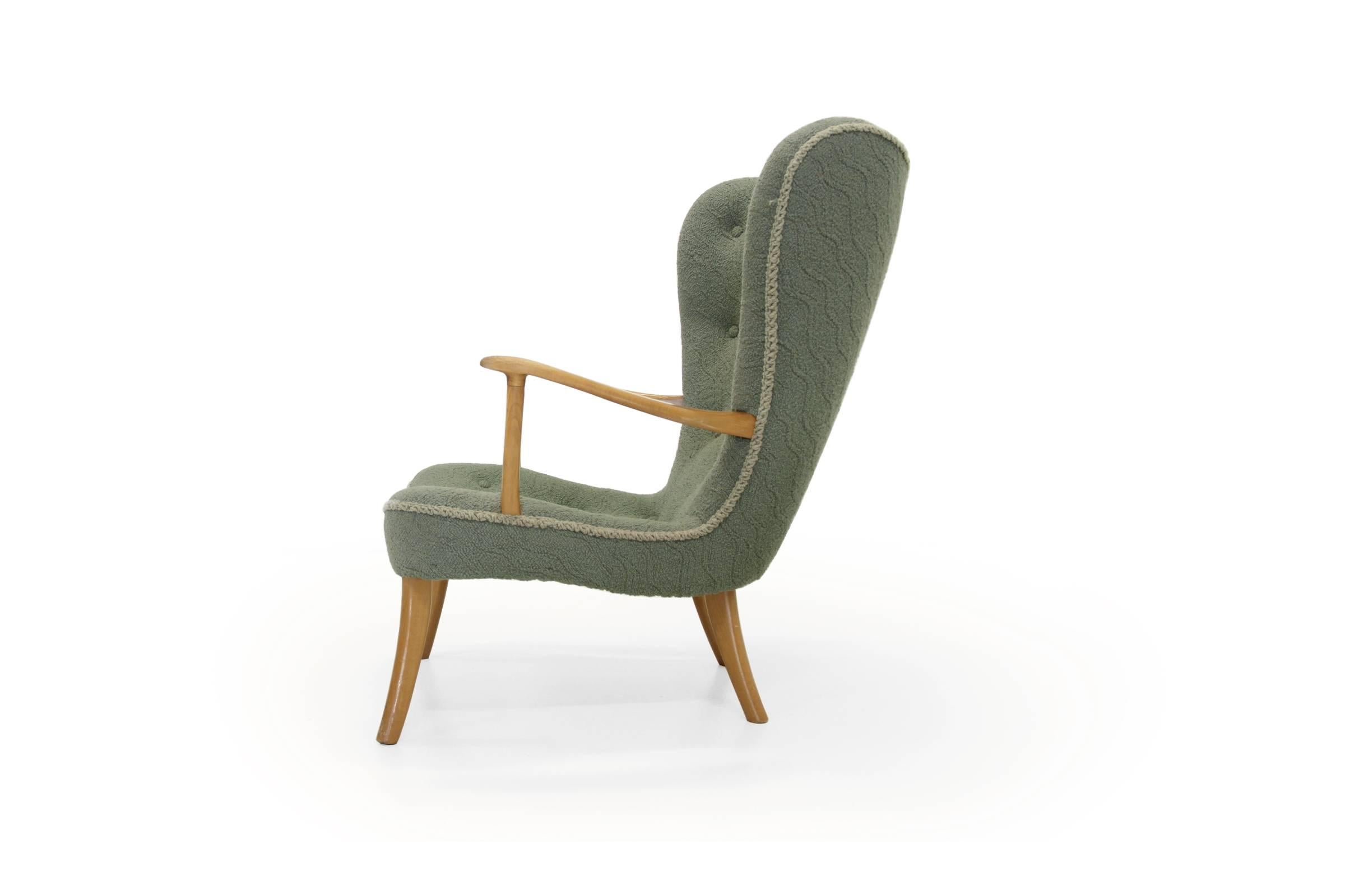Beautiful and rare lounge chair on a beech frame and original upholstery. Designed by Acton Schubell and Ib Madsen from 1954. The chair is in excellent vintage condition.