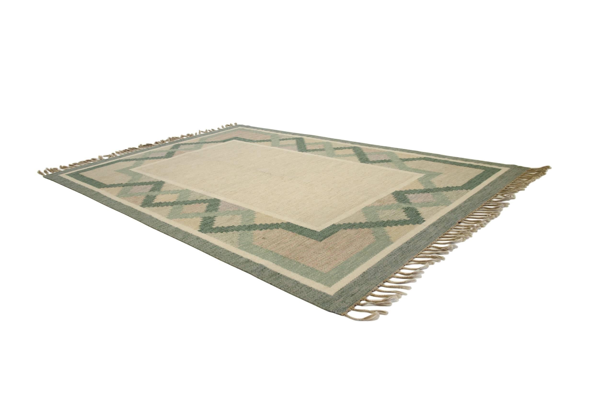 Refreshing Mid-Century rug in wool with a beautiful geometric pattern.

Made in Sweden, circa 1960 second half. Signed with 'Å