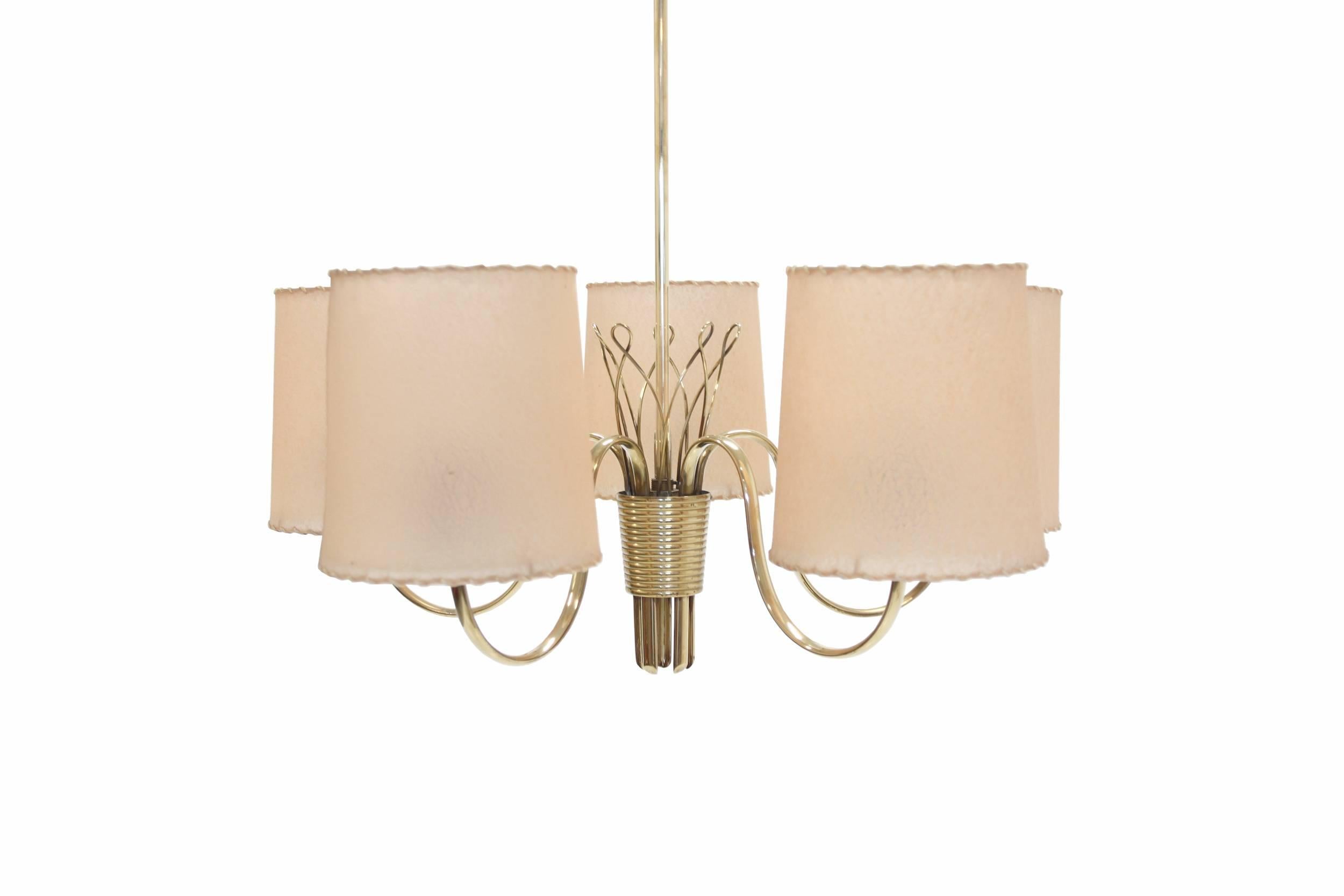 Wonderful and well made five-armed chandelier on a brass frame and frosted glass.

This is model 9031. Designed by Paavo Tynell and made in Finland by Taito circa 1960s second half.

The lamp is fully working and in excellent vintage